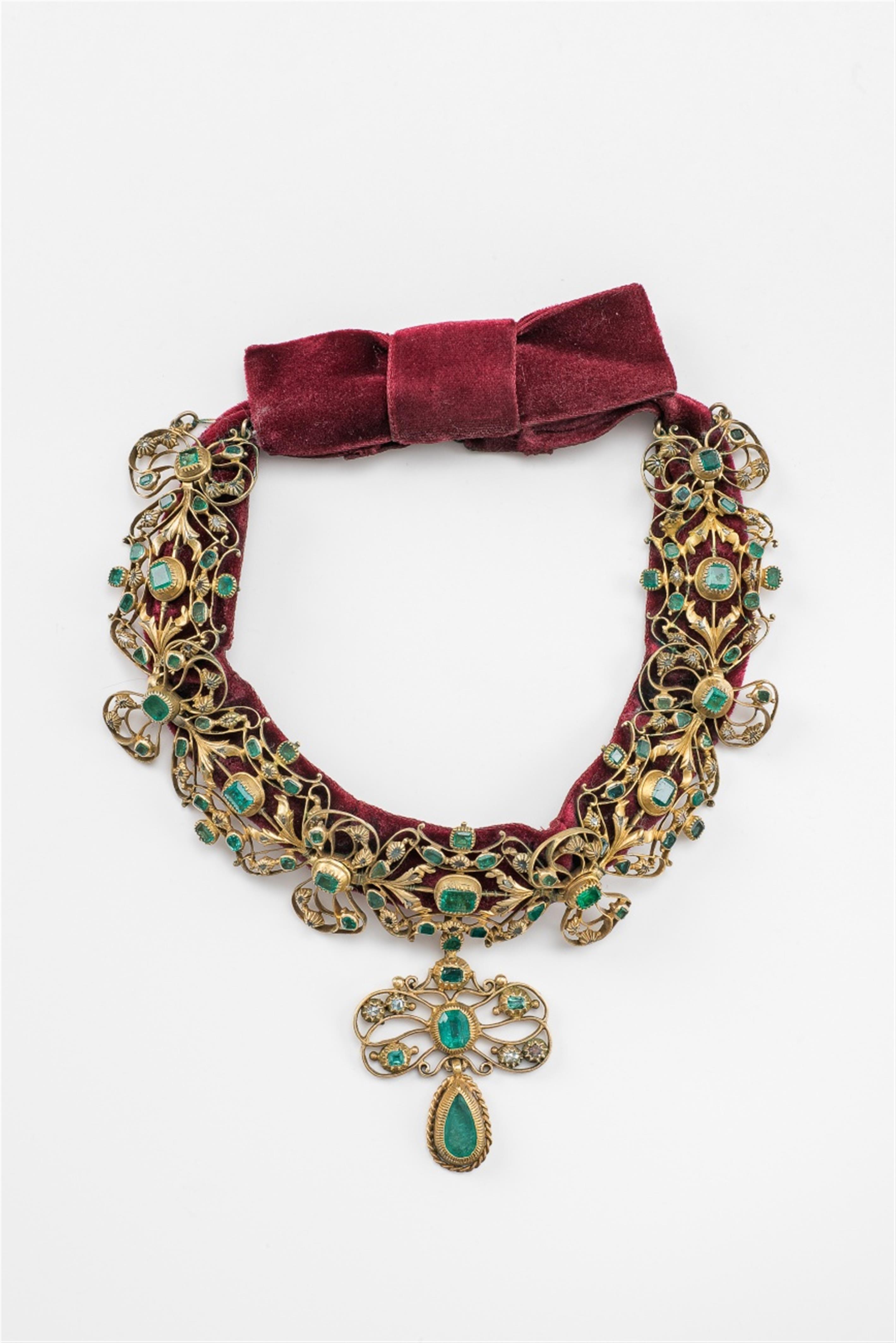A silver gilt emerald and diamond necklace - image-1