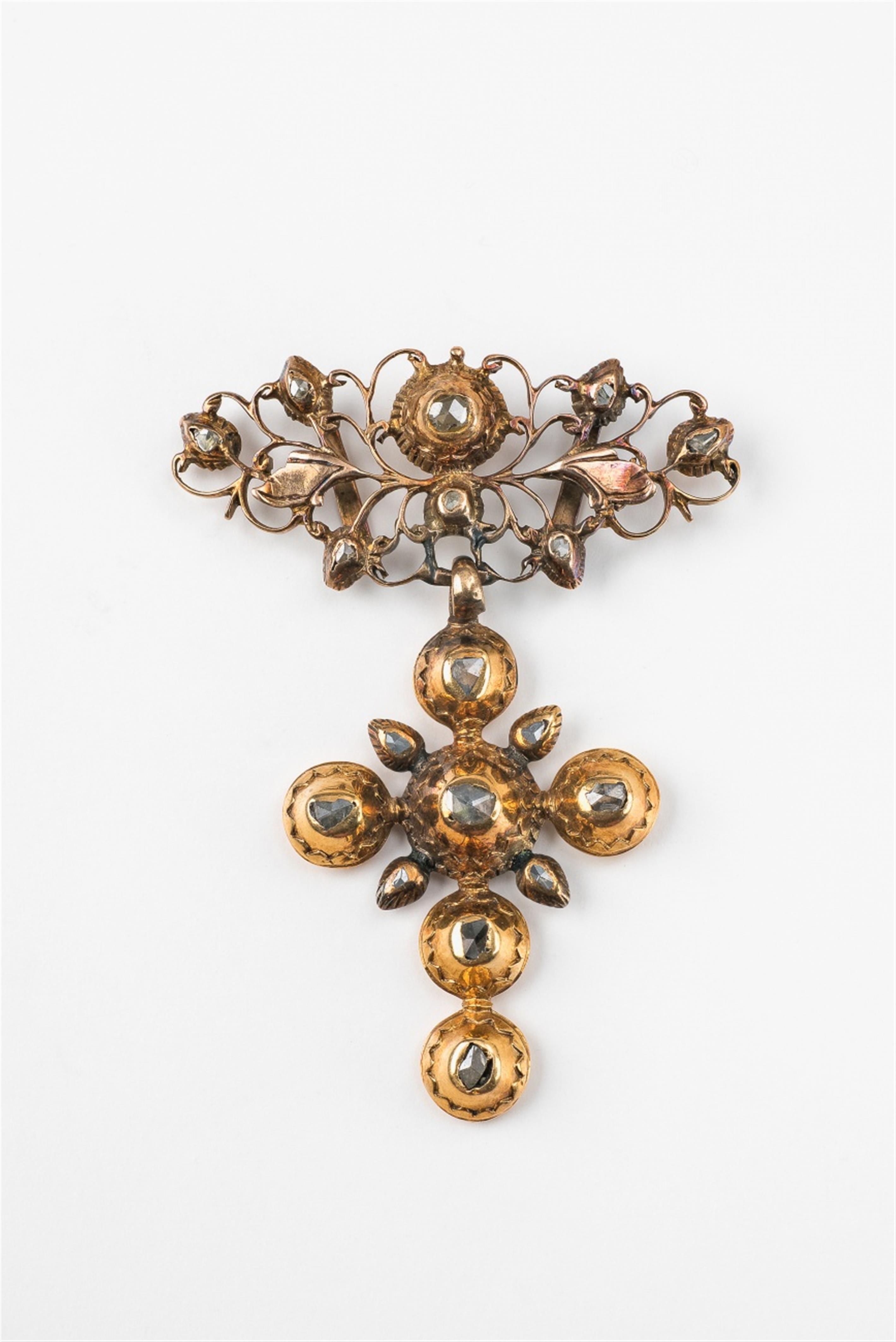 A Rococo 9k gold and diamond cross pendant - image-1