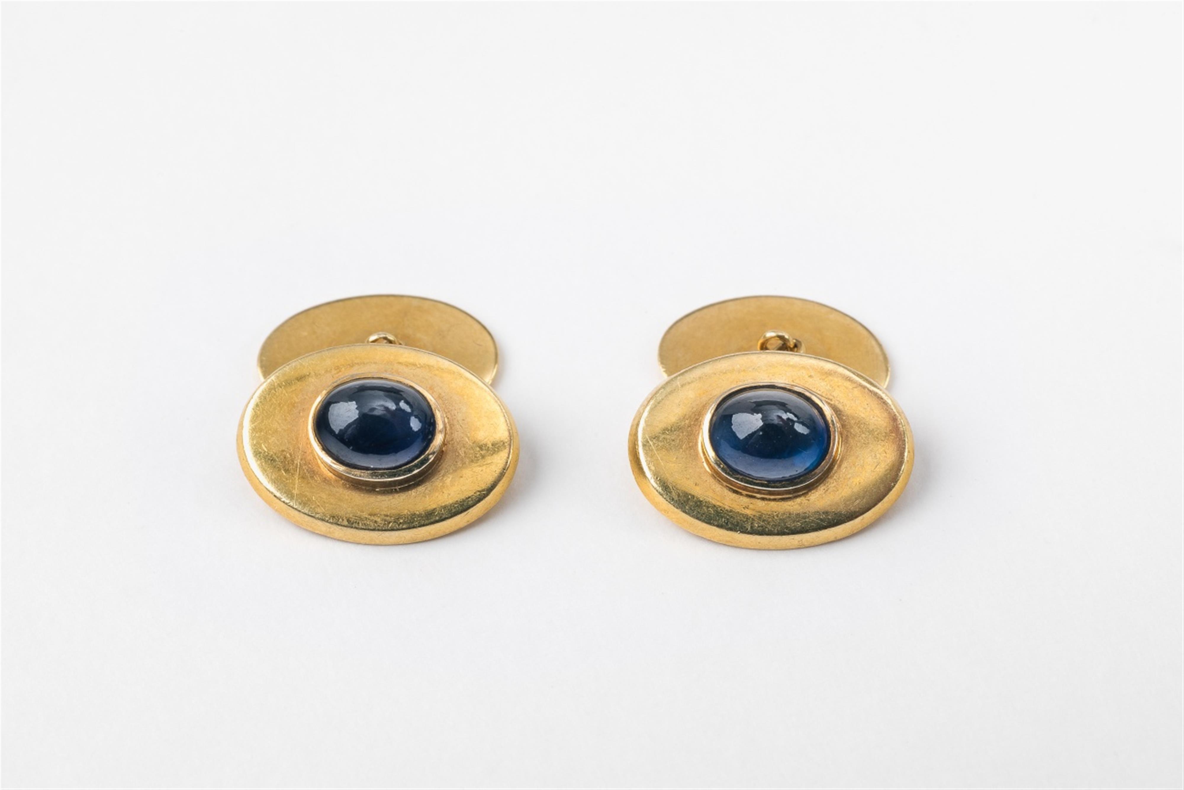 A pair of 18k gold and sapphire ladies cufflinks - image-1