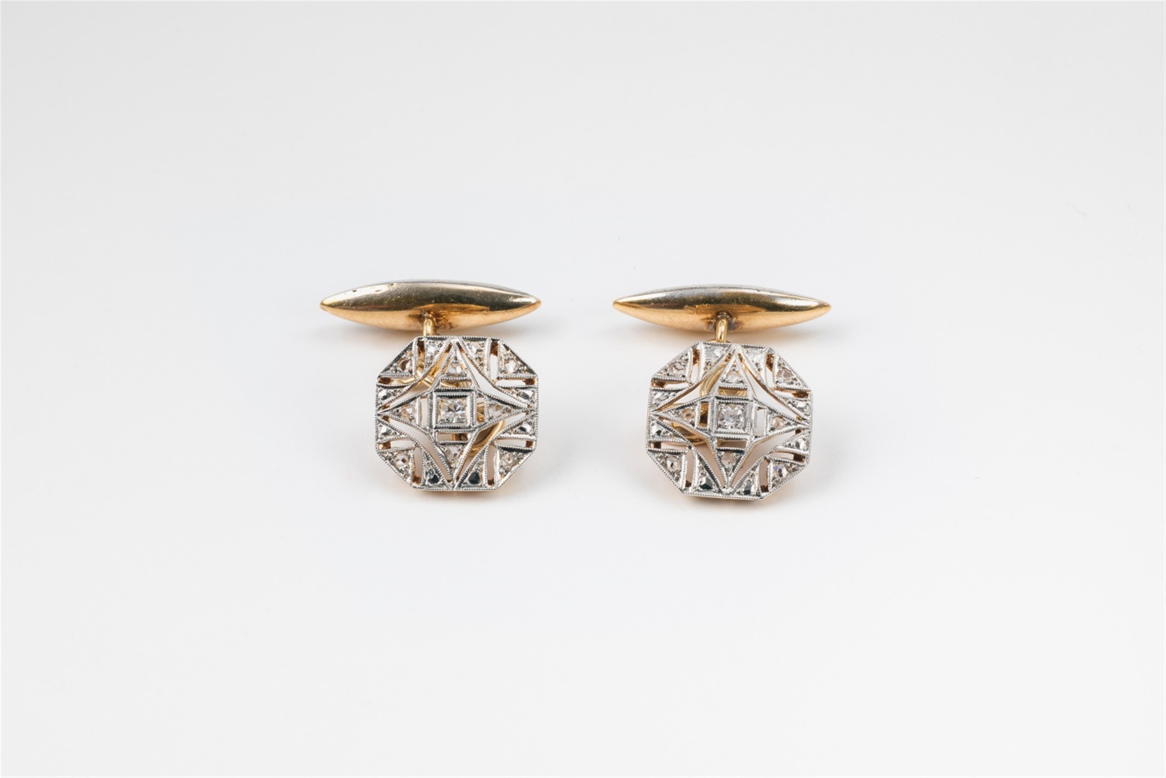 A pair of 14k gold and diamond cufflinks - image-1