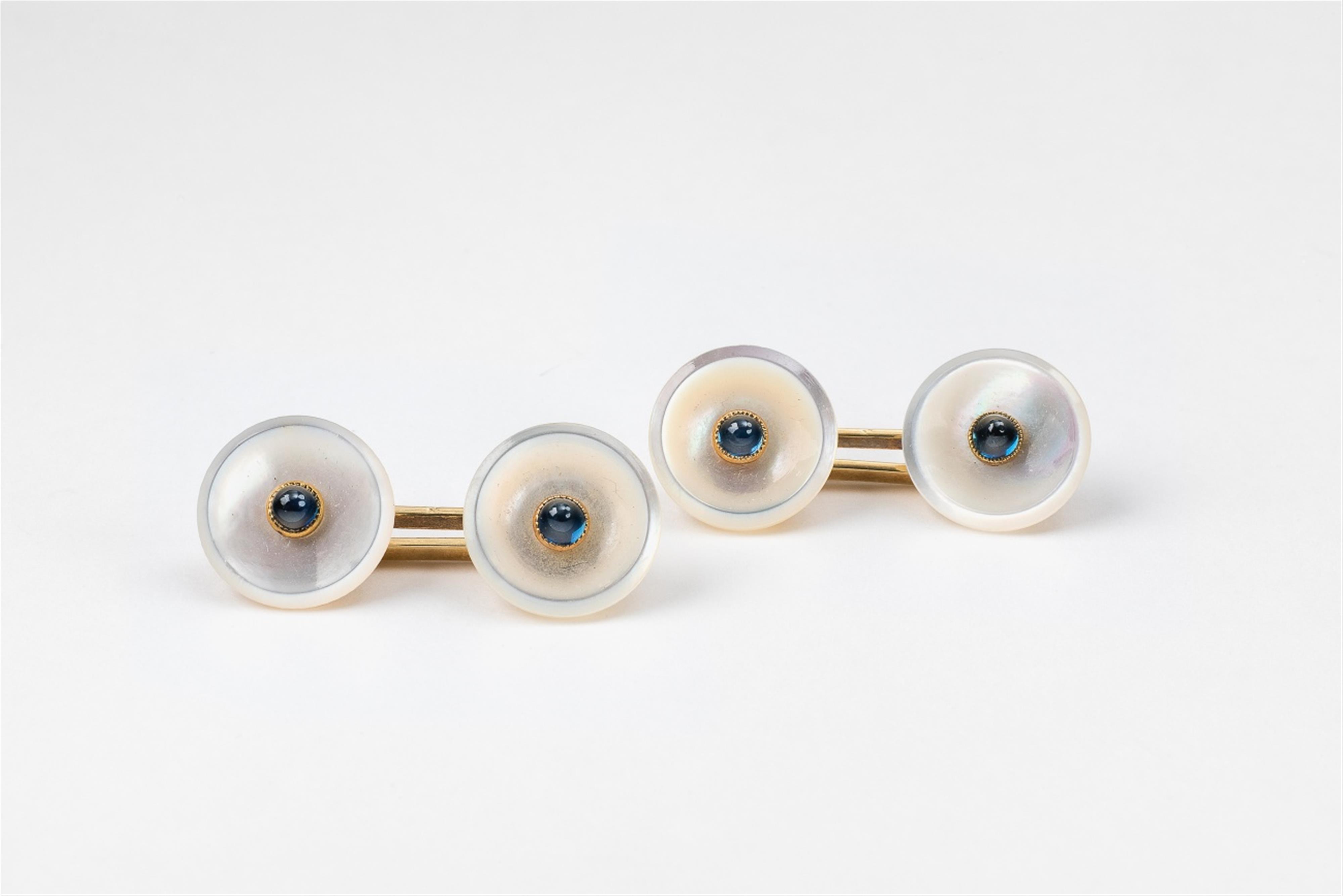 A pair of 14k gold mother-of-pearl and sapphire cufflinks - image-1