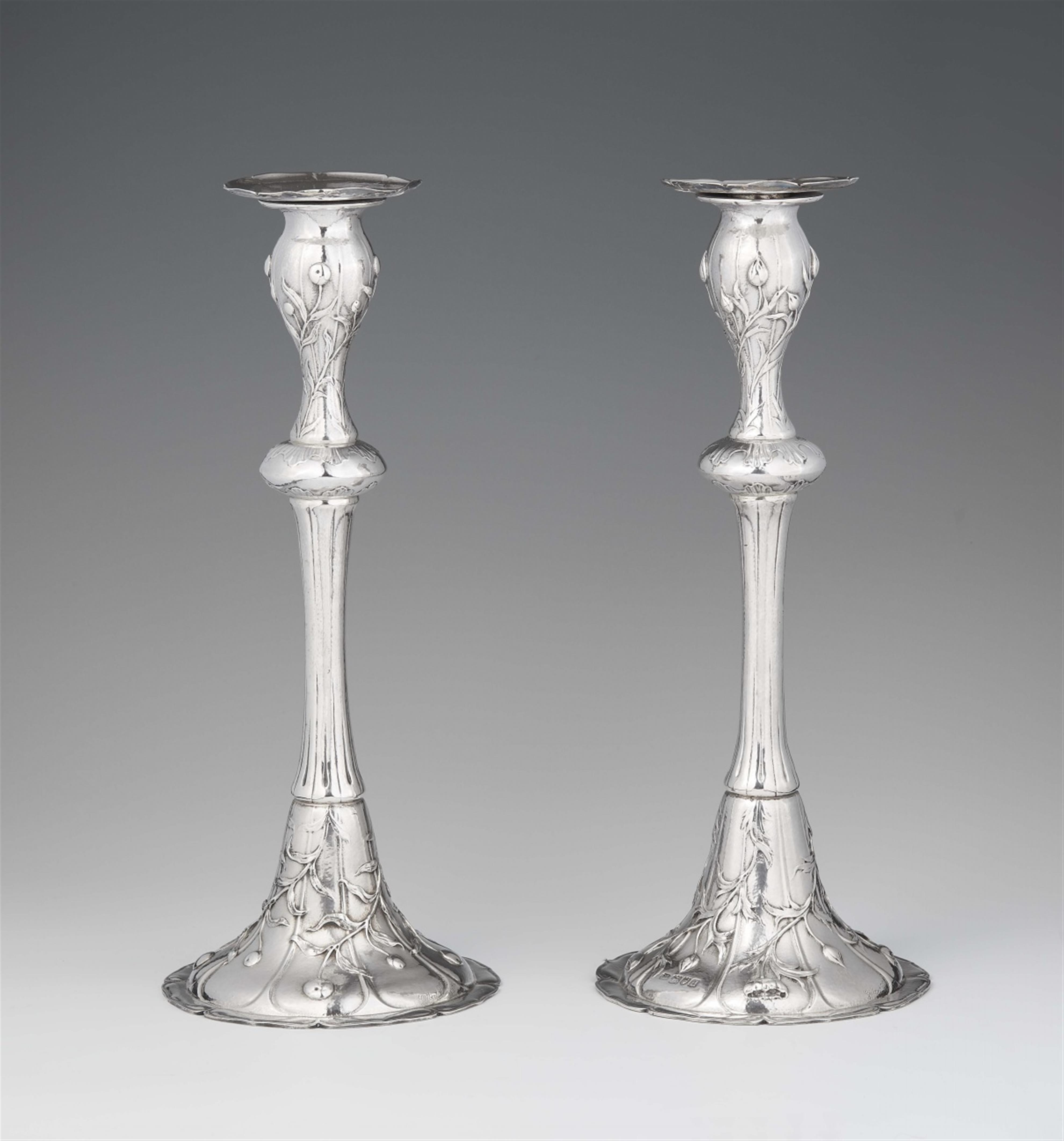 A rare pair of Arts and Crafts silver candlesticks - image-1