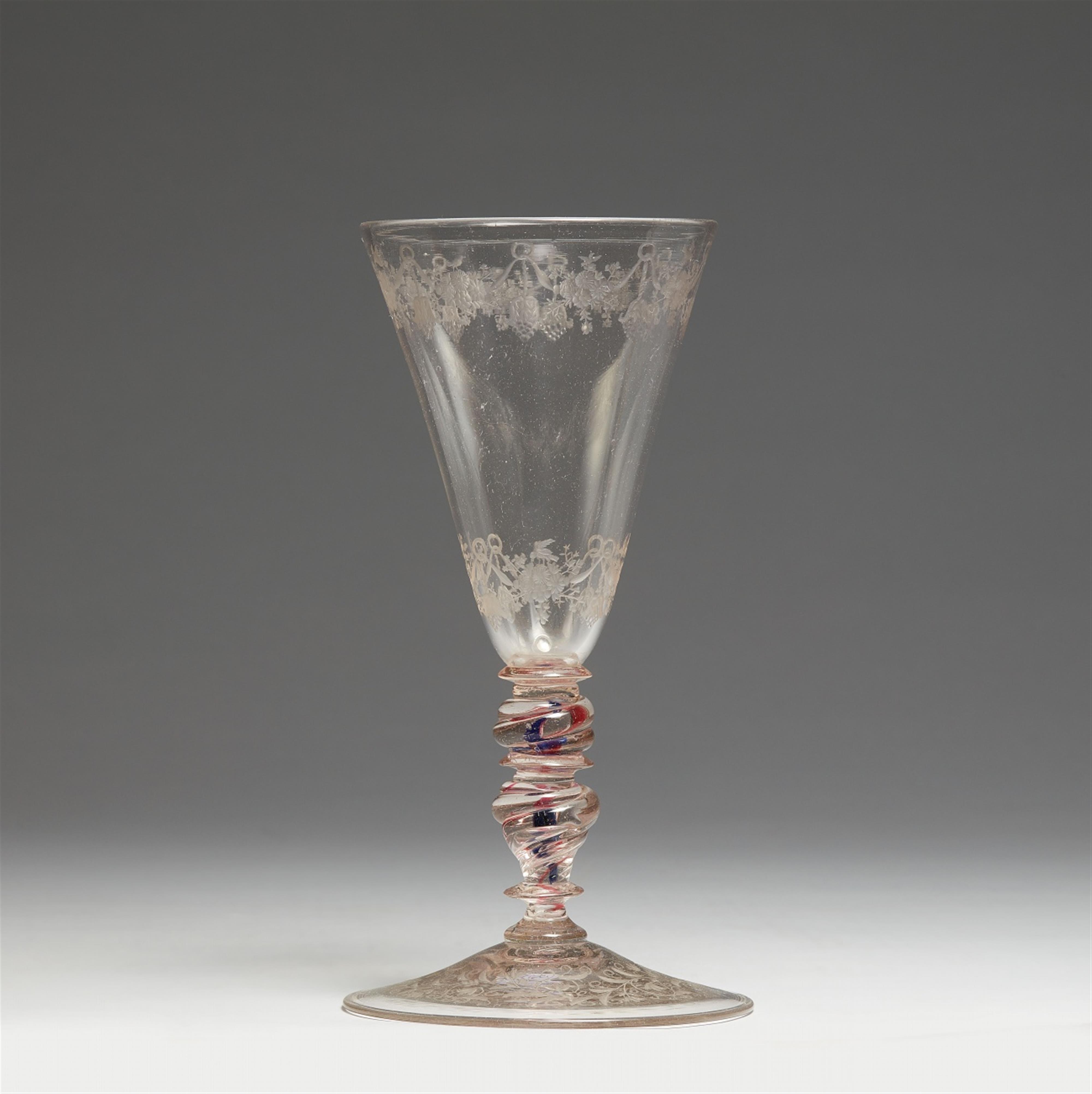 A glass goblet with floral decor - image-1