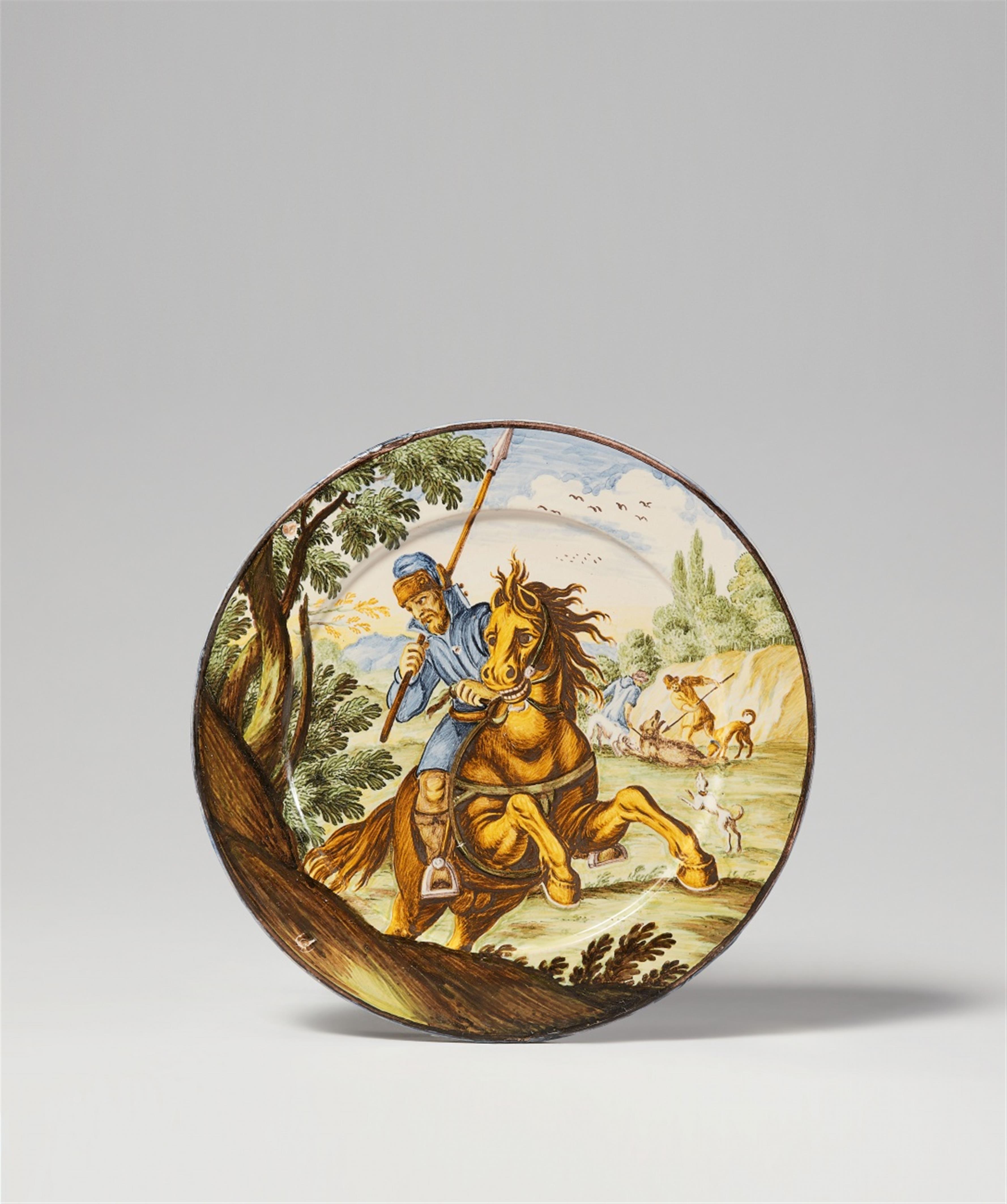 A South Italian polychrome maiolica plate with a horseman and a bear hunt - image-1
