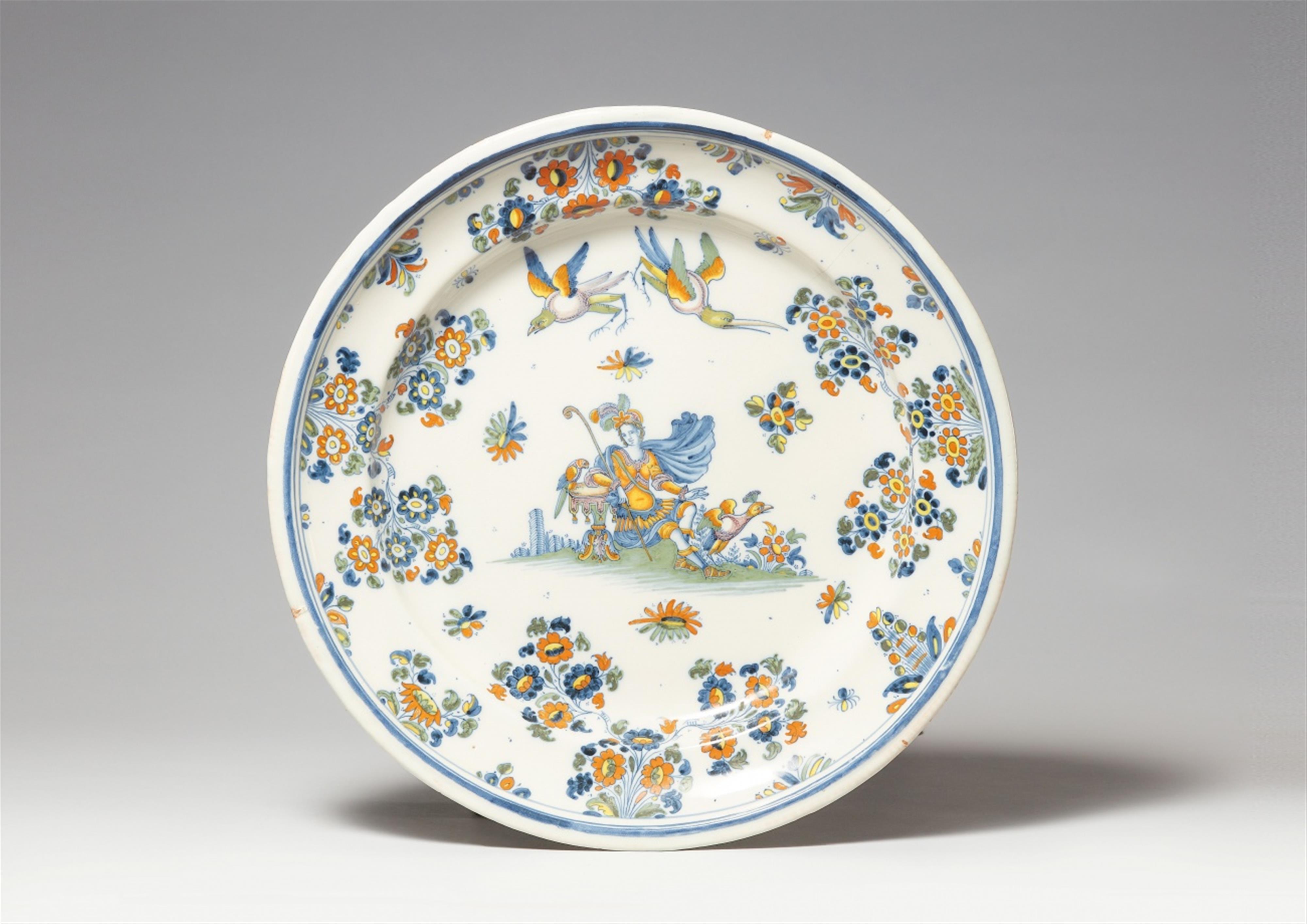 A round Alcora faience platter with a goddess - image-1