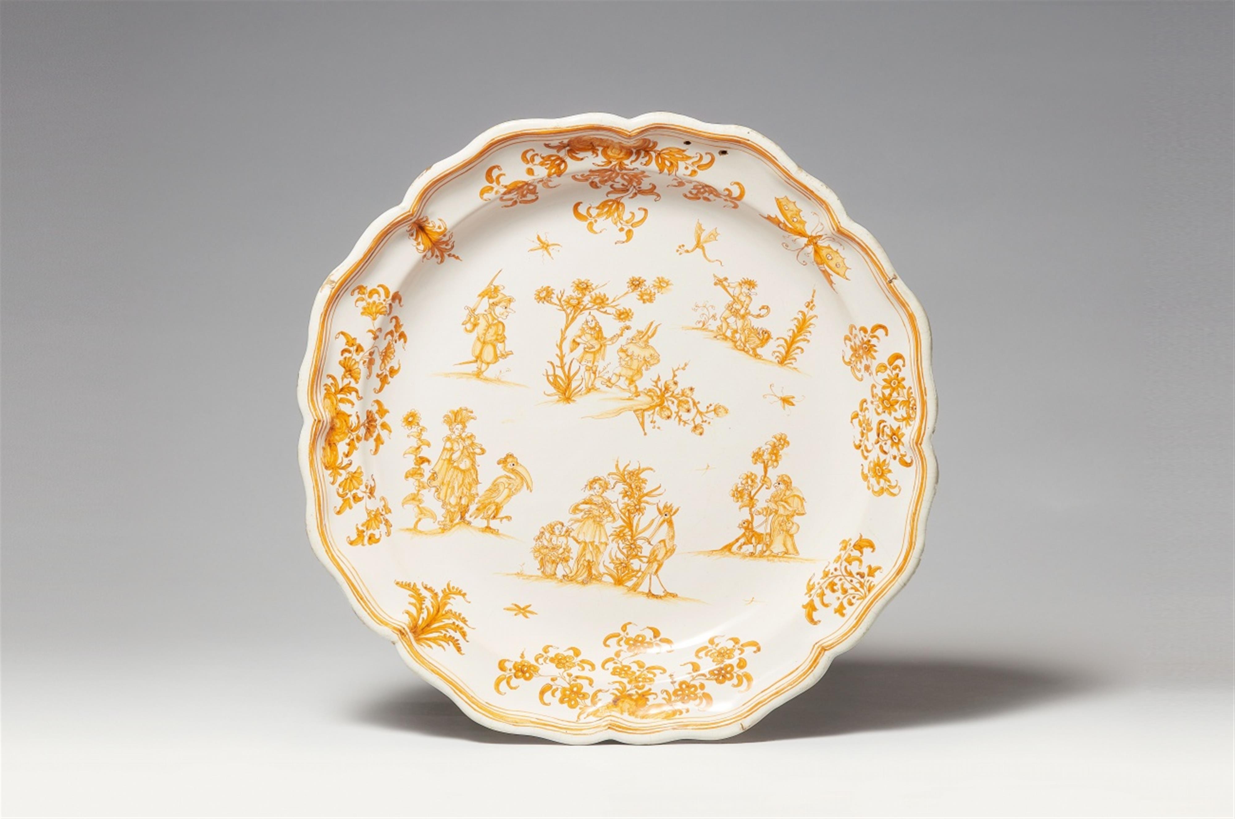 A Moustiers faience platter with grotesques - image-1