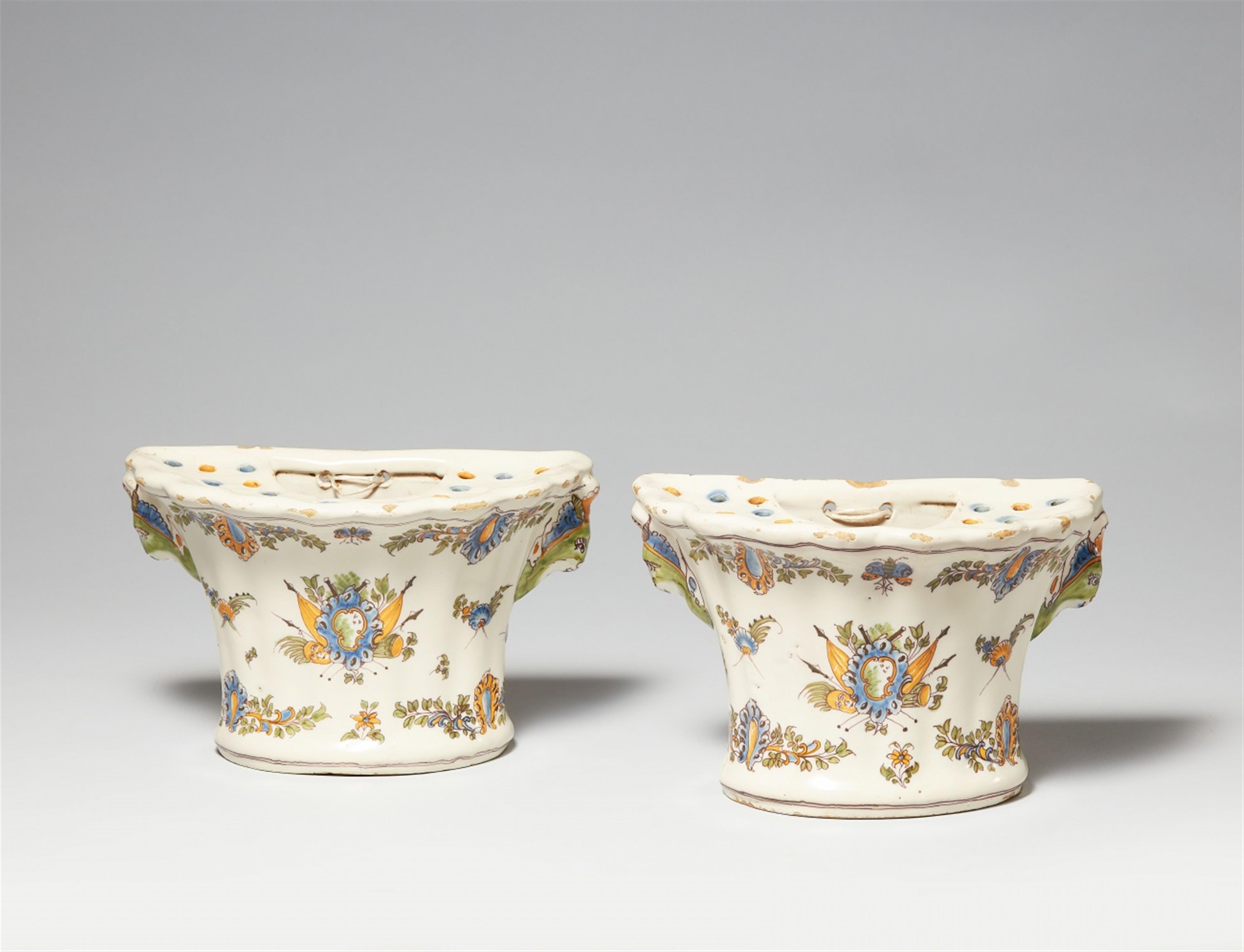 A pair of Moustier faience wall vases 'aux drapeaux' - image-1