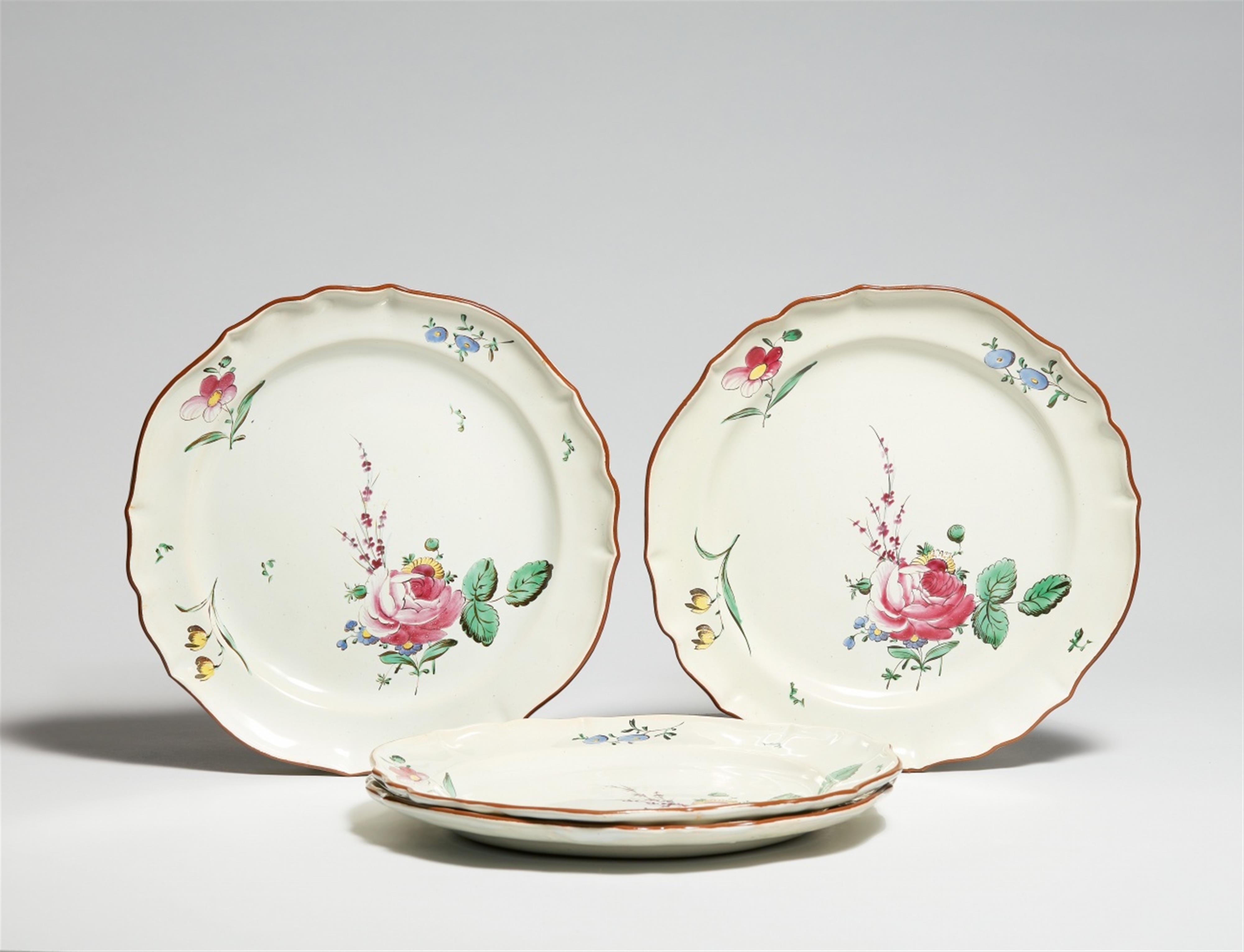 Four Lodi faience plates with floral decor - image-1