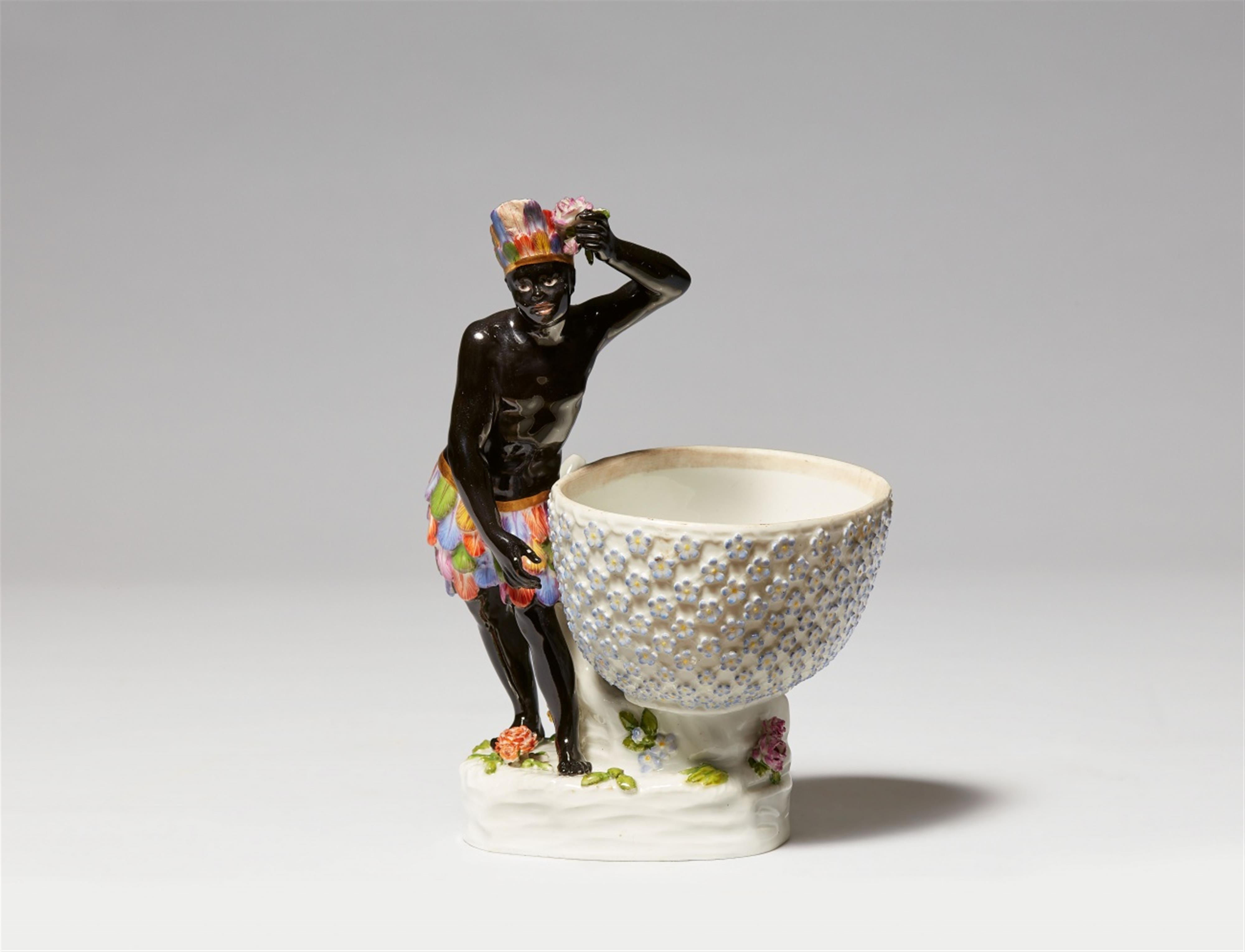 A Berlin KPM porcelain box with a figure of an African man - image-1
