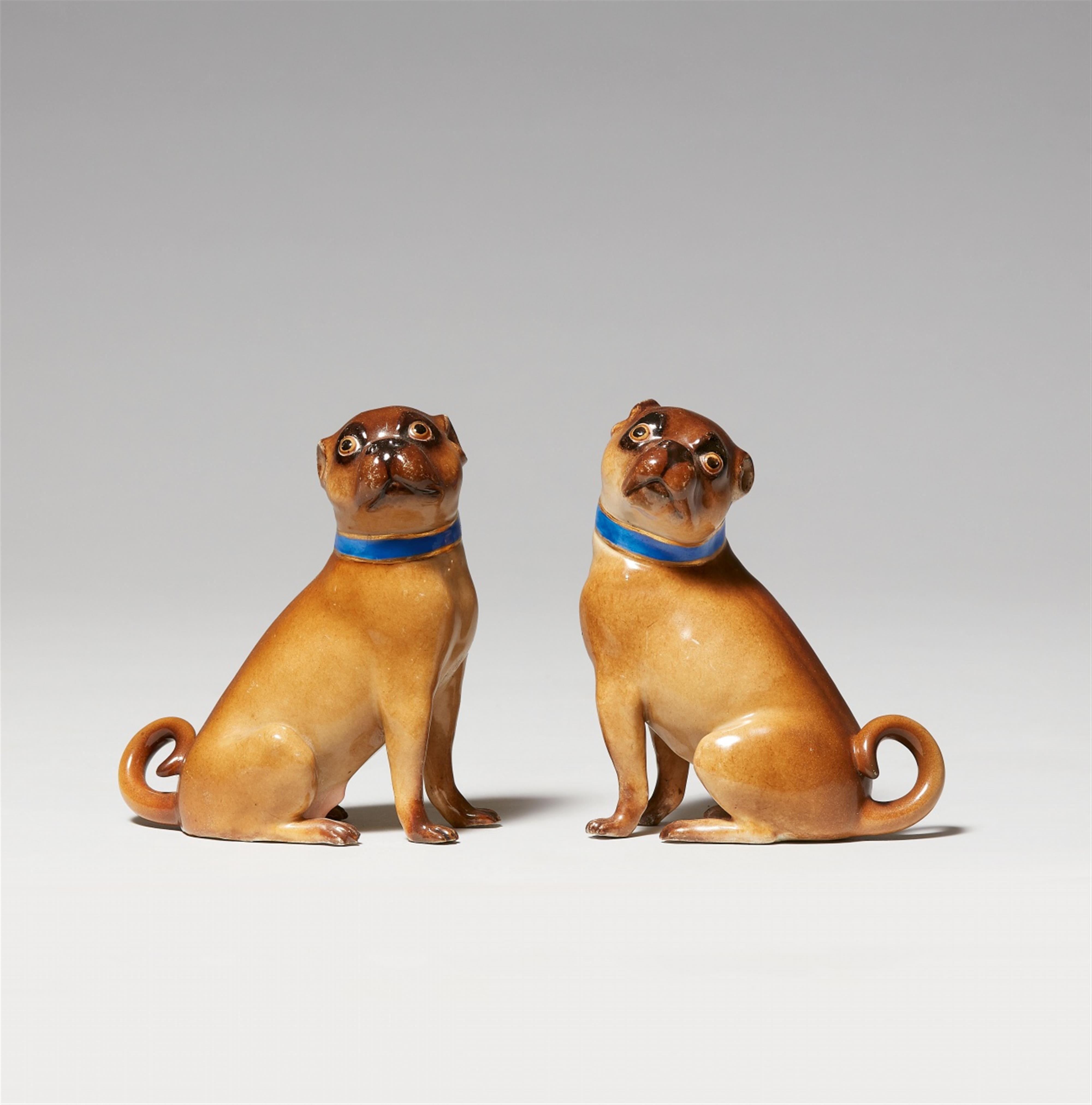 A pair of seated Meissen porcelain pug dogs - image-1