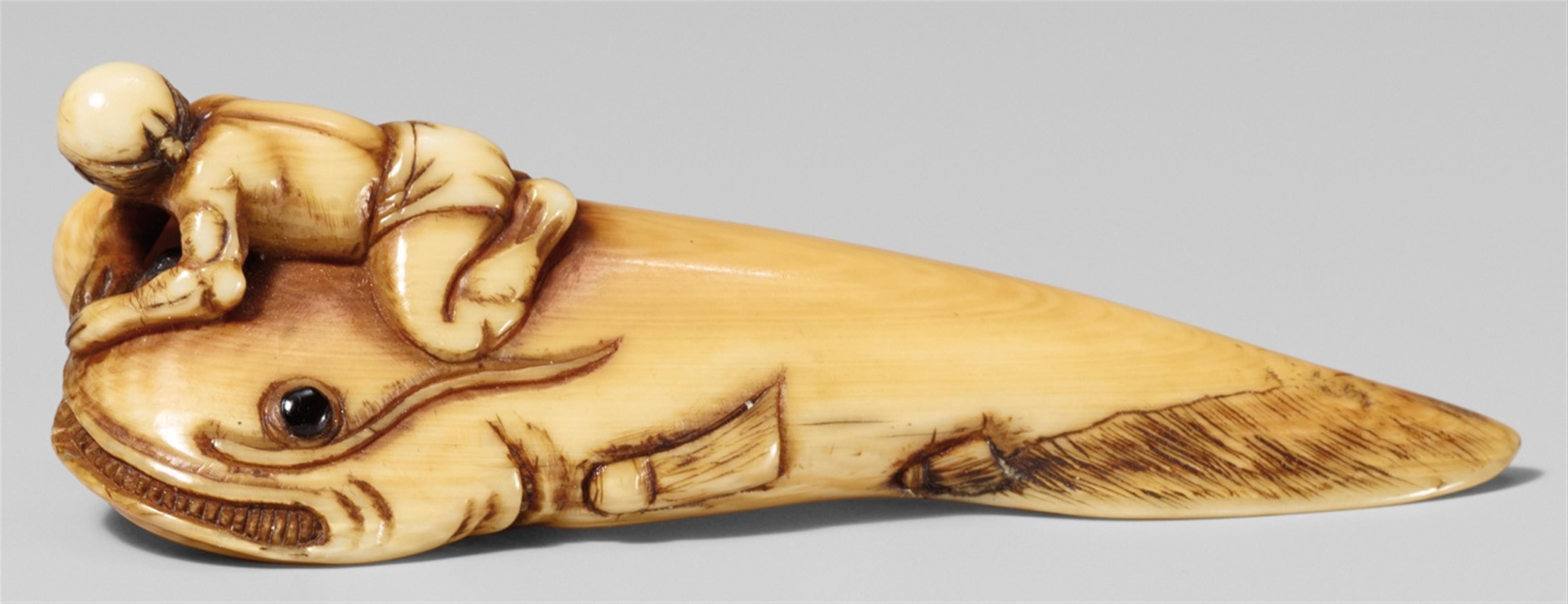 A partially stained ivory netsuke of Kadori Myôjin on a catfish. First half 19th century - image-1