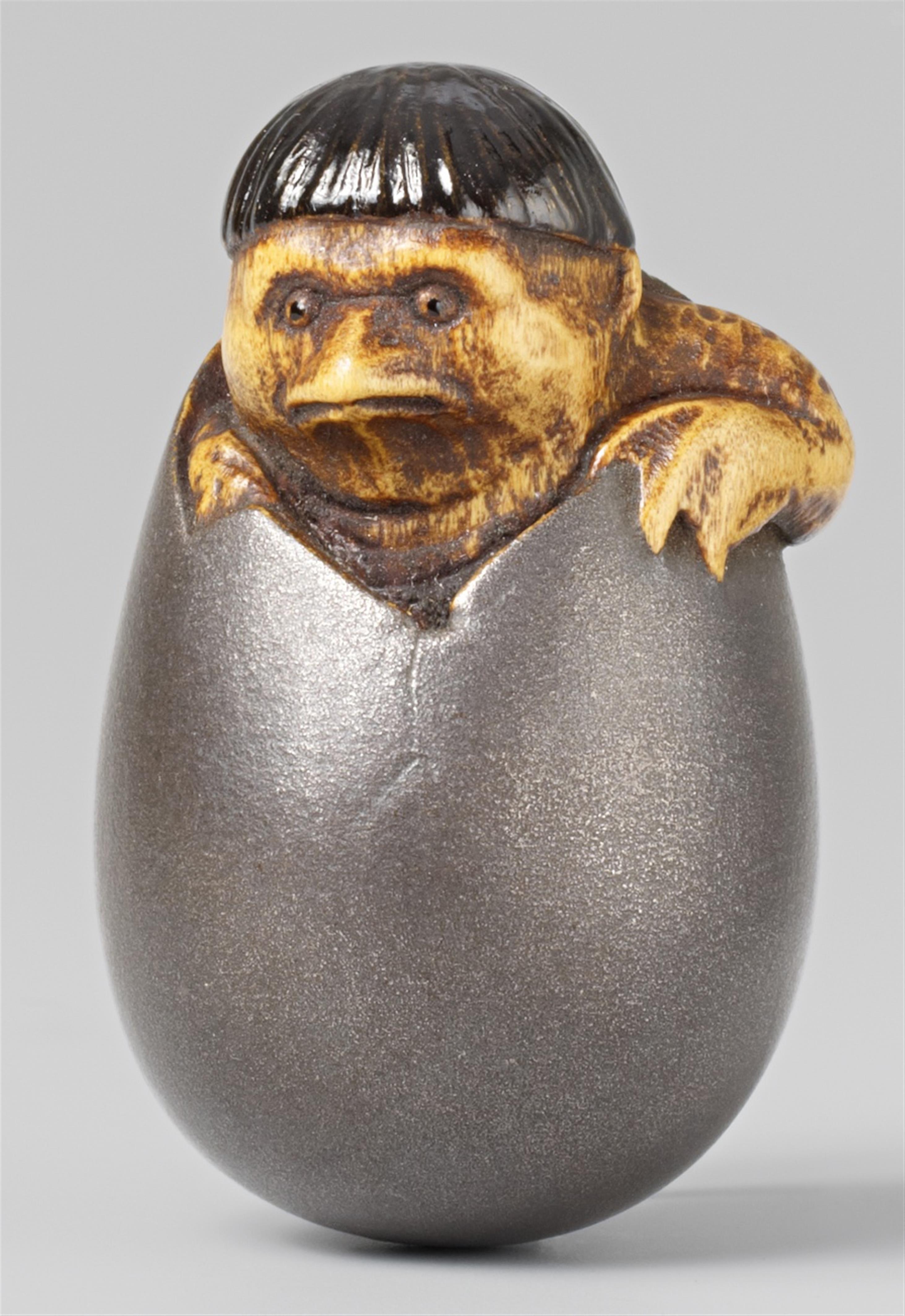 A wood and lacquer netsuke of a kappa breaking out from an egg. Second half 19th century - image-1