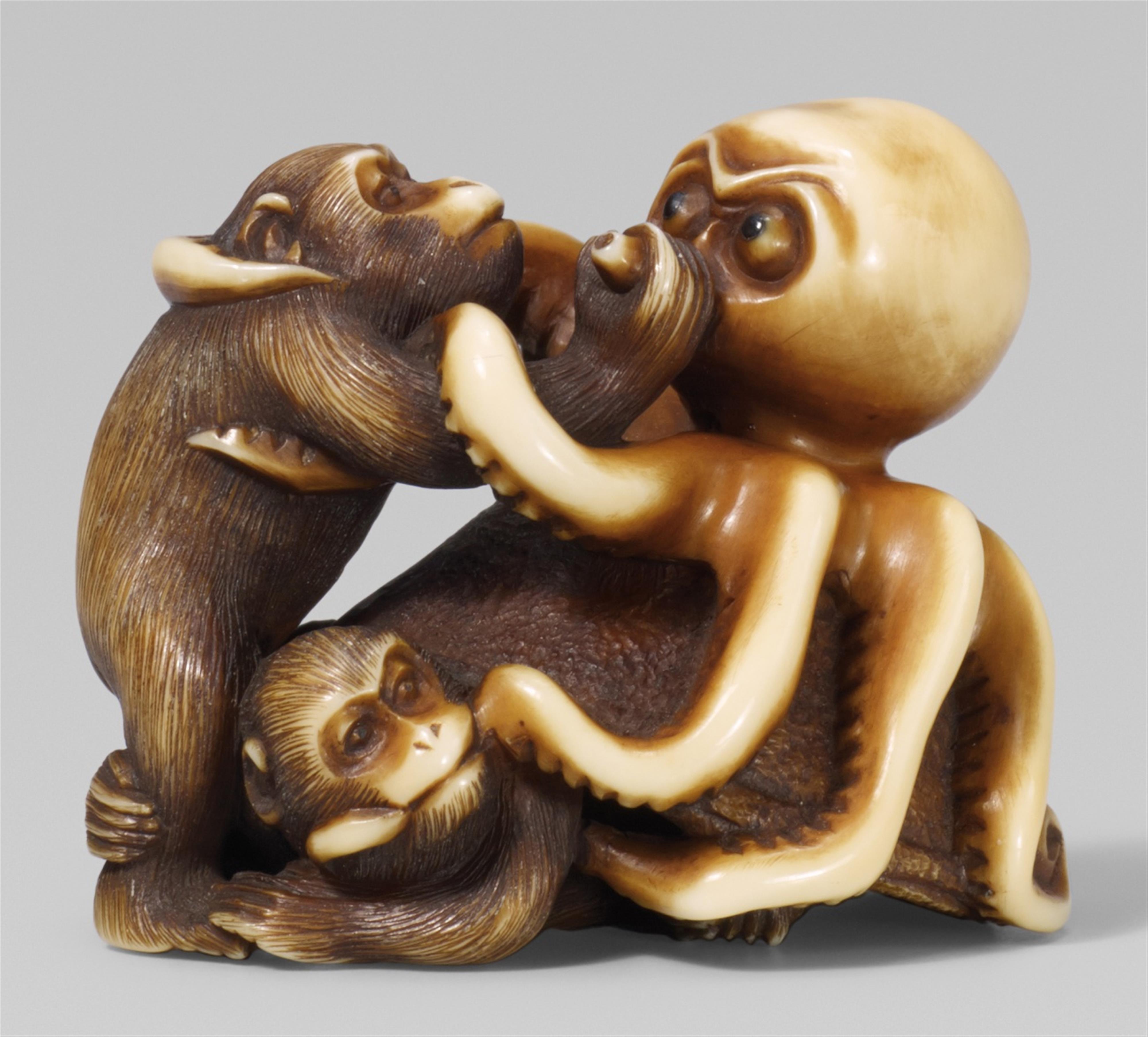 A Edo school ivory netsuke of an octopus fighting two monkeys, by Ikkôsai. Mid-19th century - image-1