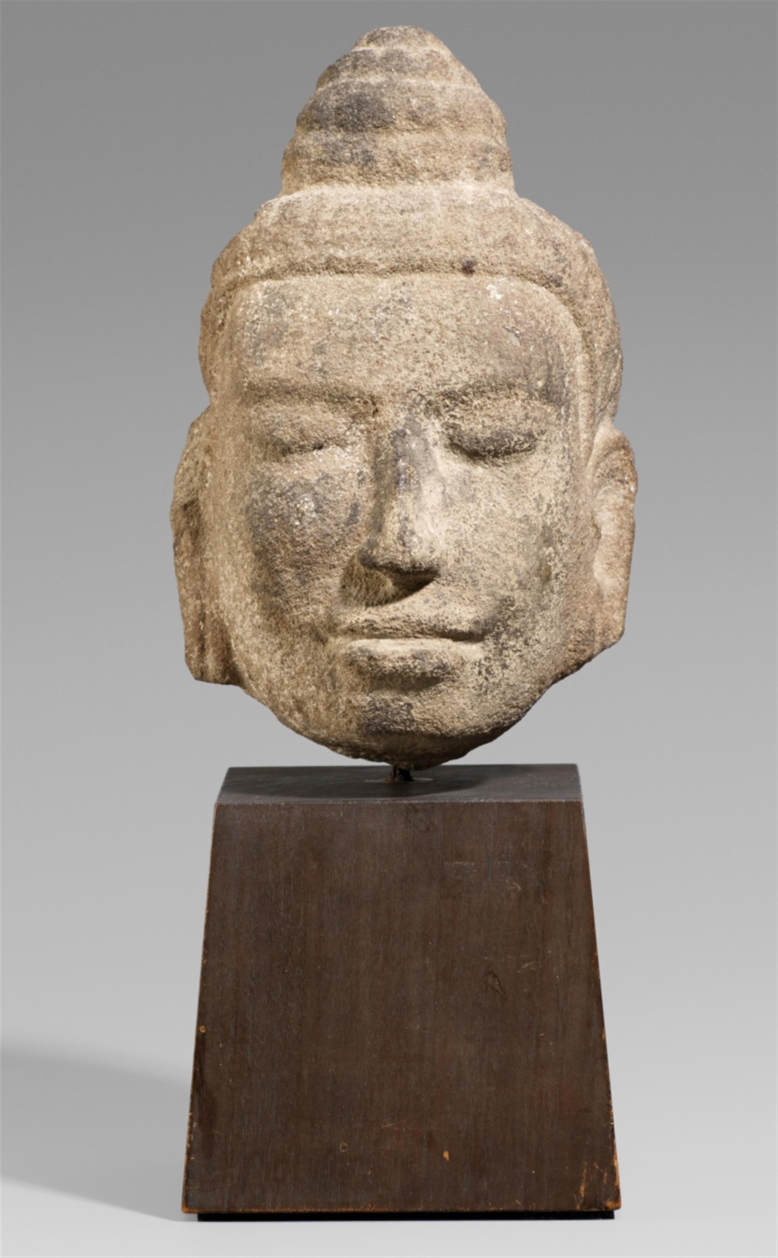 A Cambodian sandstone head of a deity. Ca. 11th/12th century - image-1