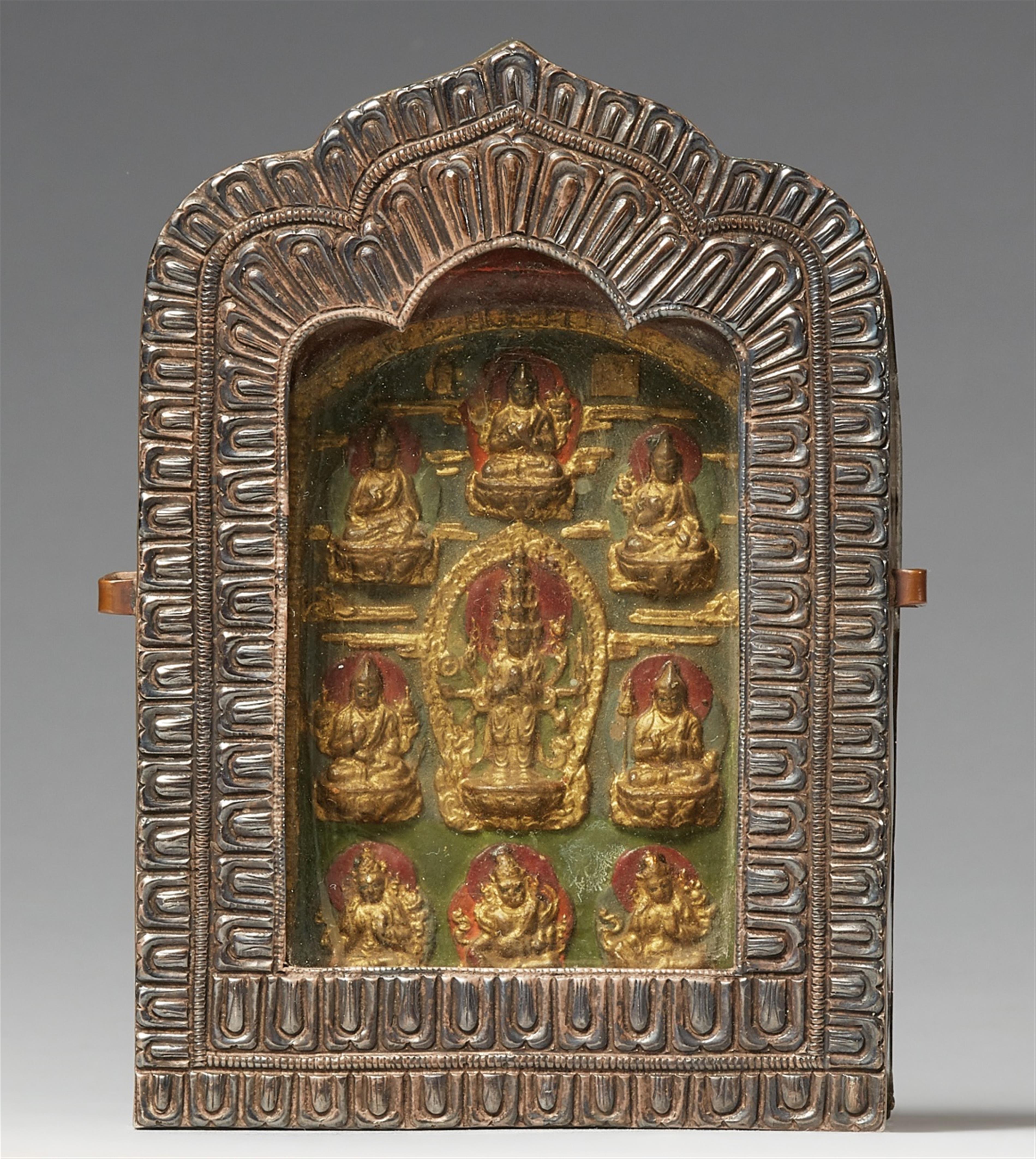 A Tibetan silver and copper ga´u with a tsatsa of Avalokiteshvara - image-1