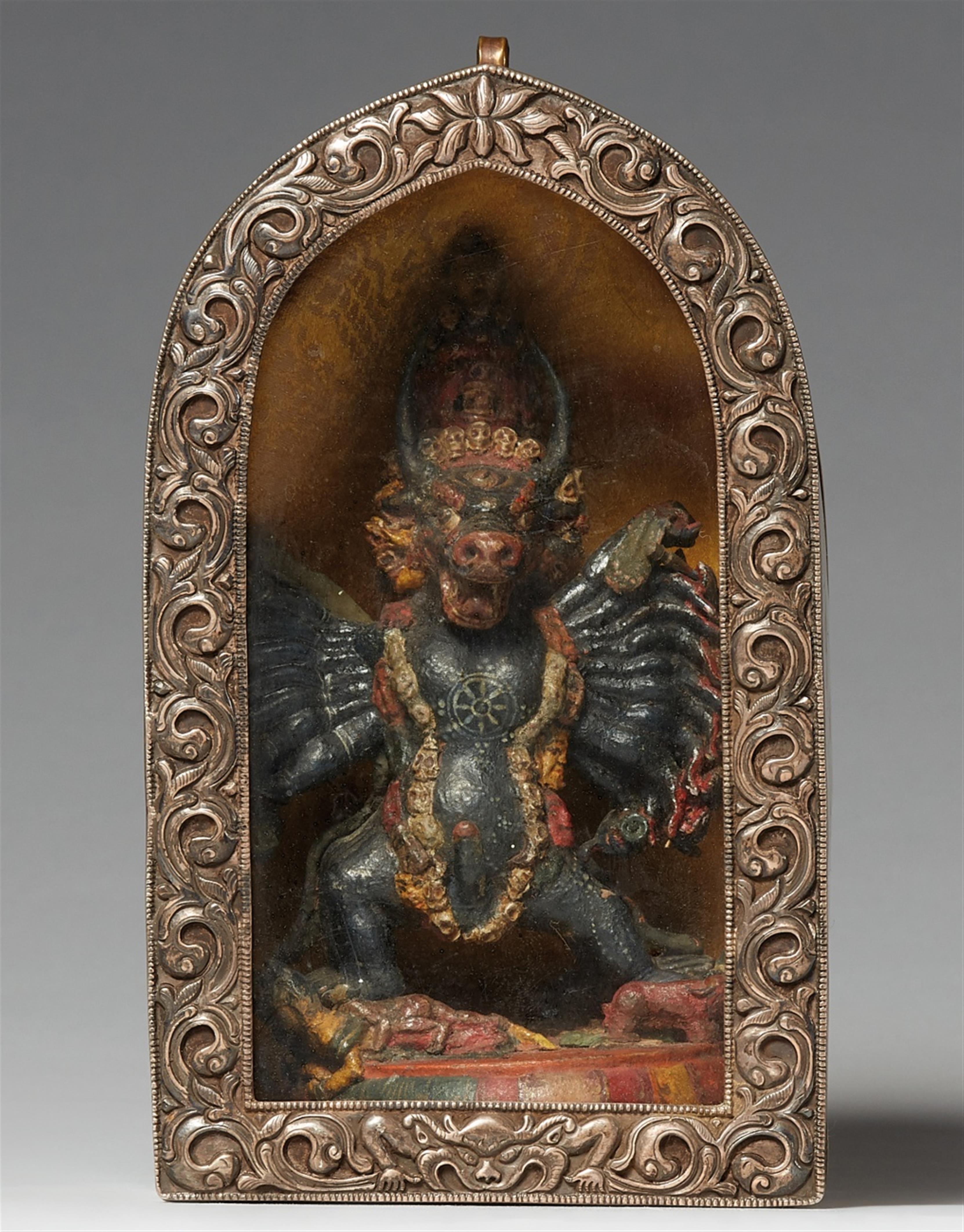 A Tibetan silver and brass ga´u with a wooden figure of Vajrabhairava - image-1