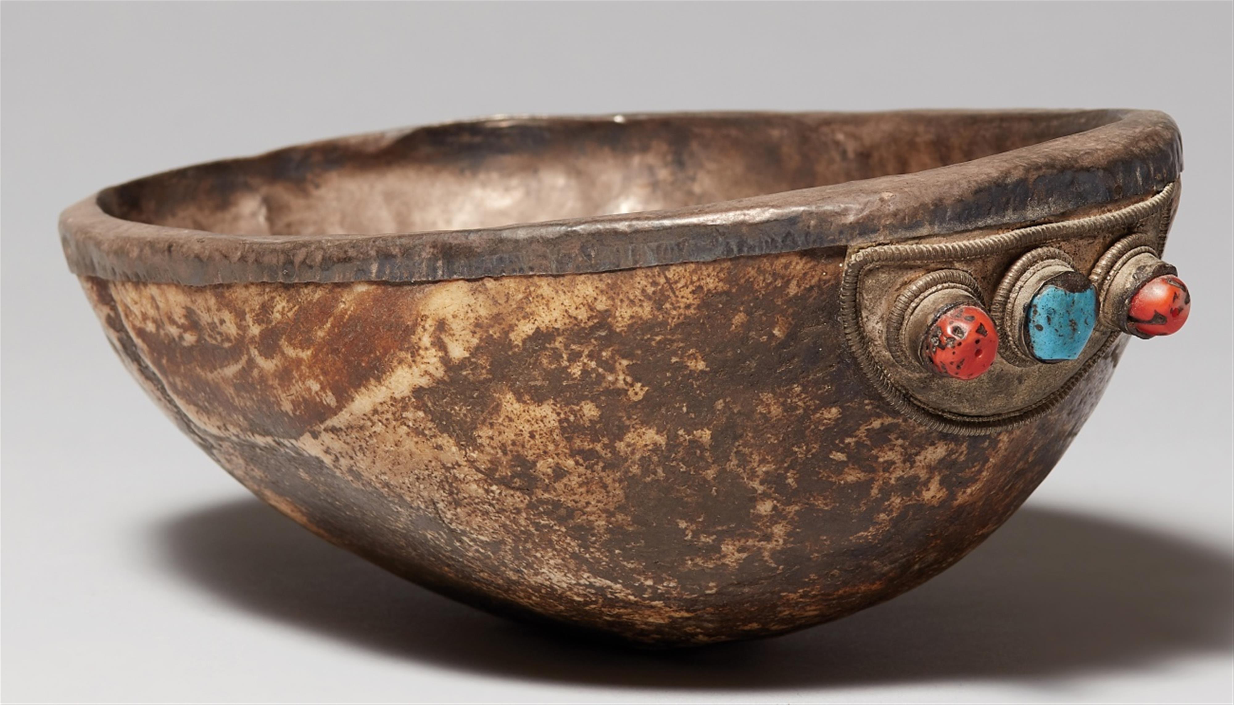 A Tibetan skull-cup (kapala) with silver lining - image-1