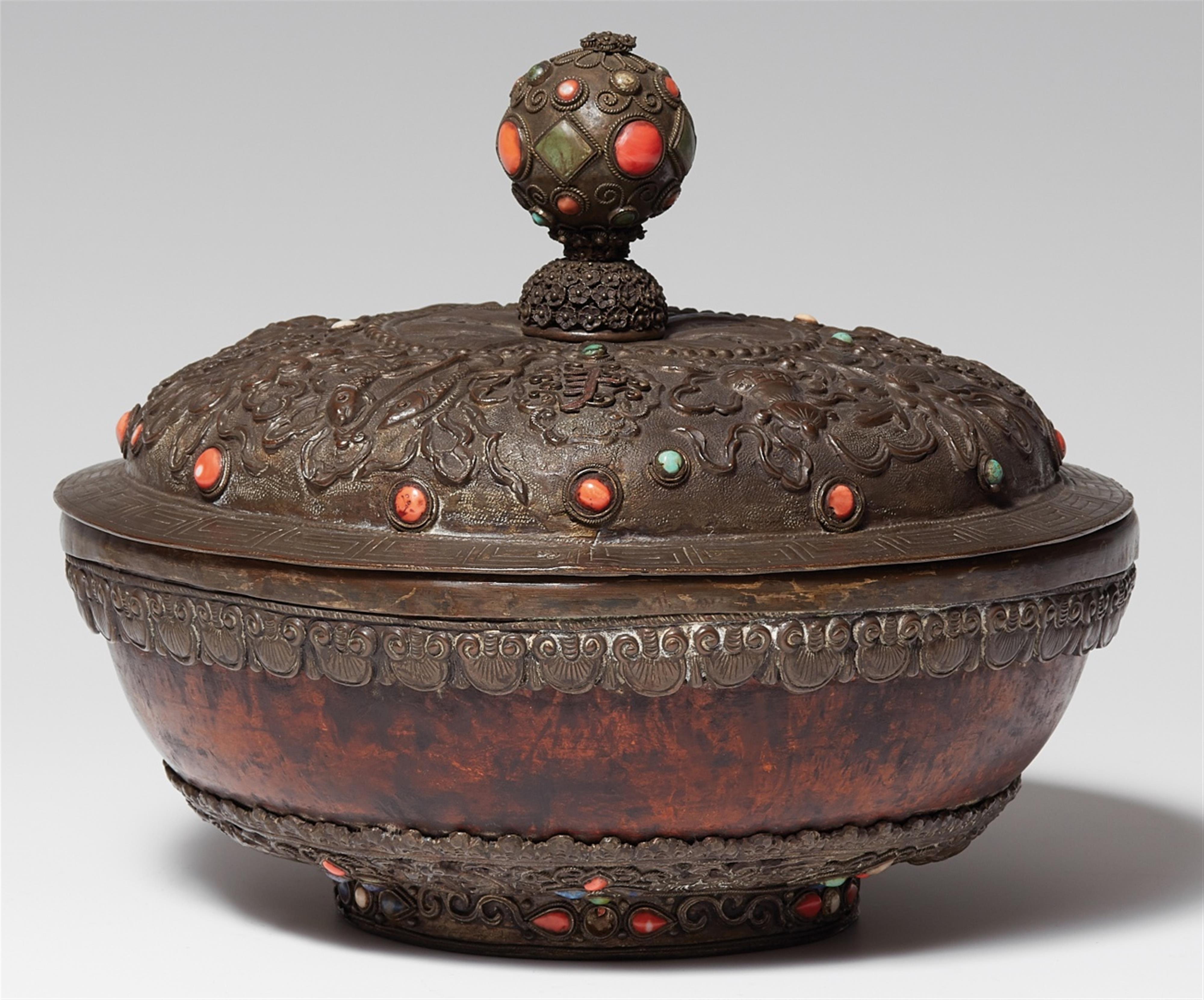 A Tibetan circular burl wood box with a metal lid - image-1