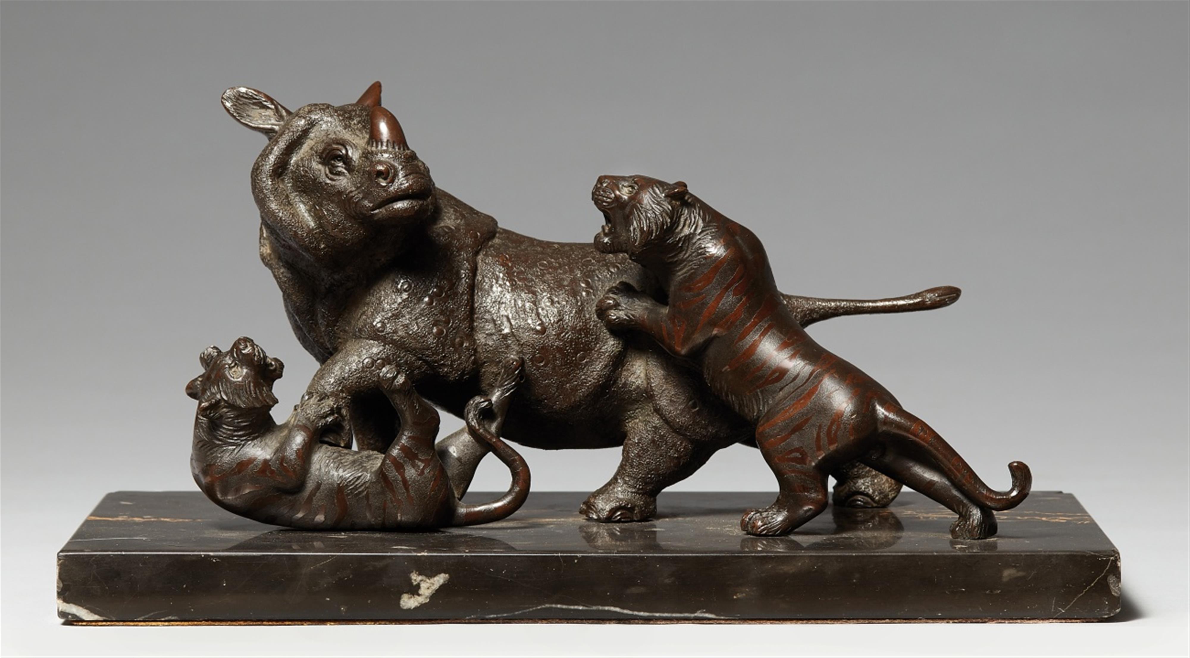 A bronze okimono of a rhinoceros and two tigers. Around 1900 - image-1