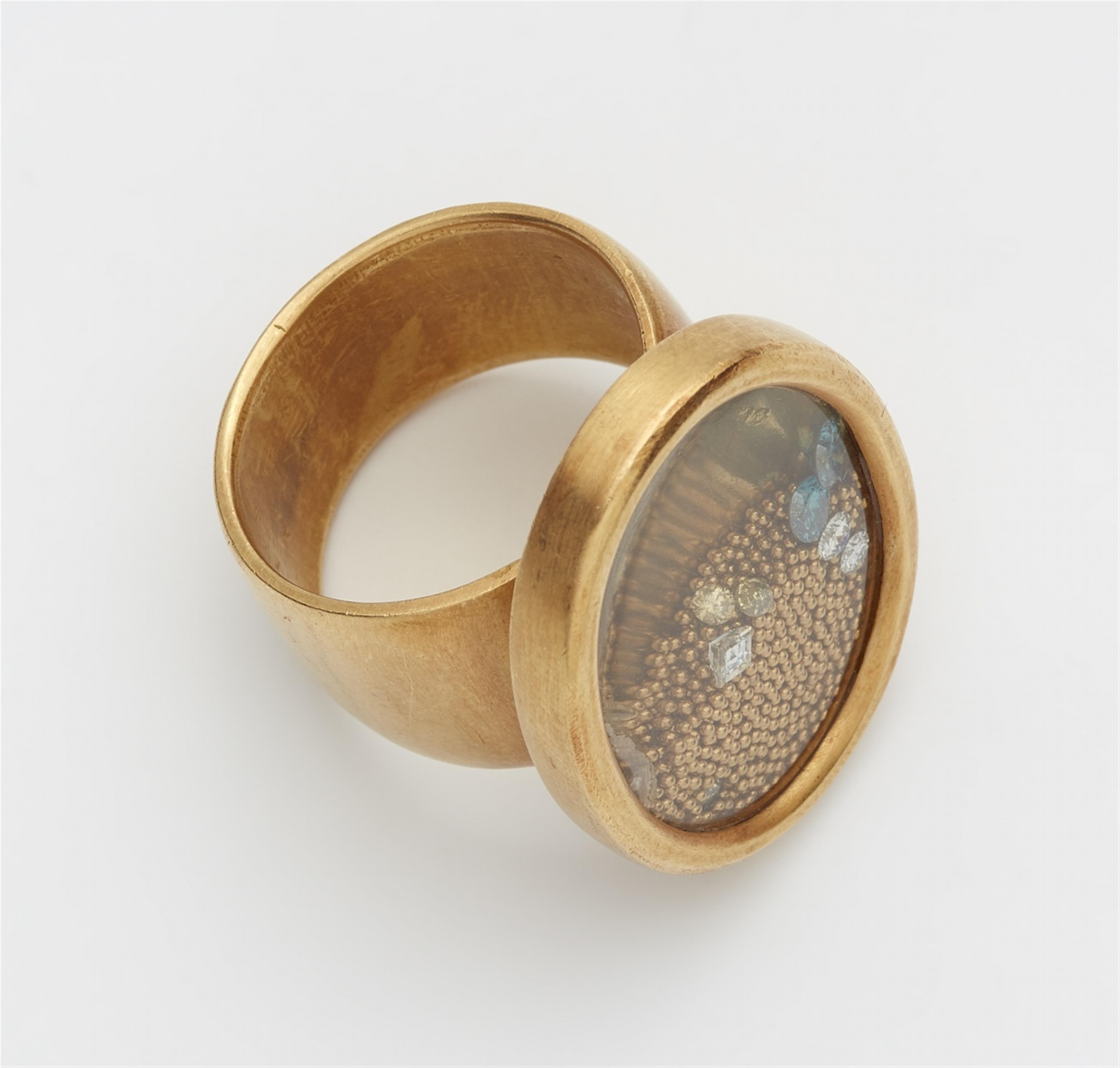 An 18k gold kinetic capsule ring - image-2