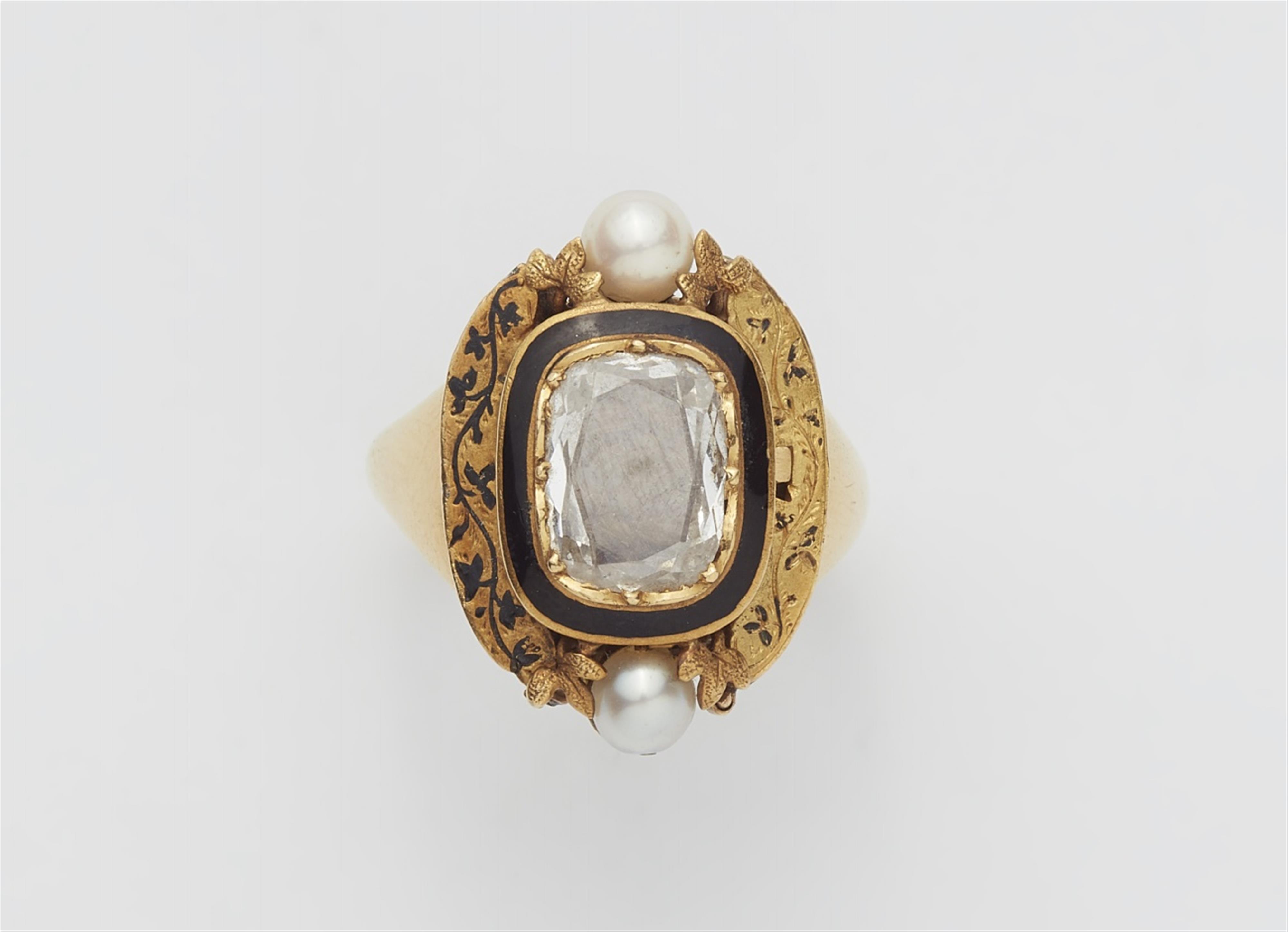 An 18k gold ring with a hairwork miniature - image-1