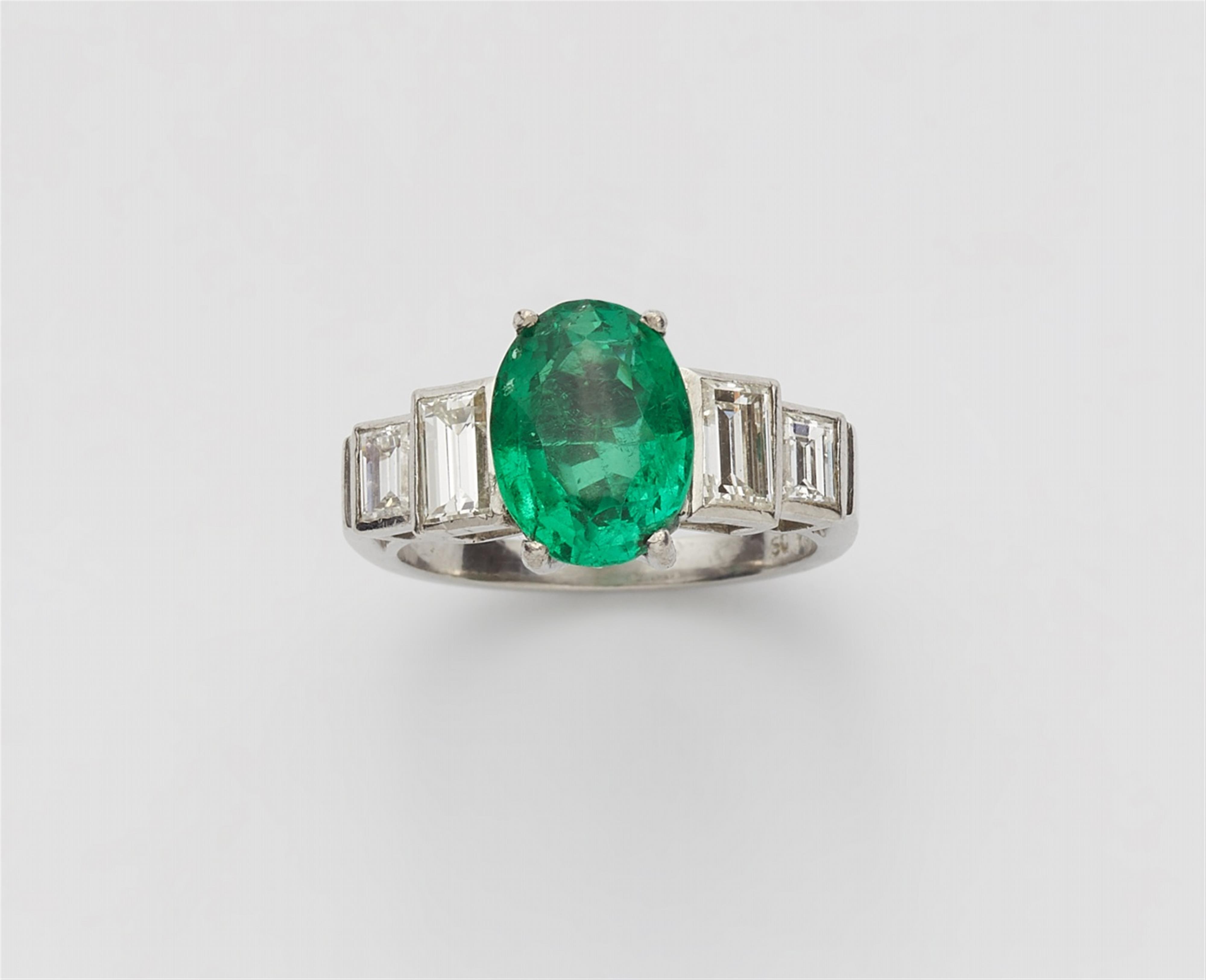 A platinum and emerald five stone ring - image-1