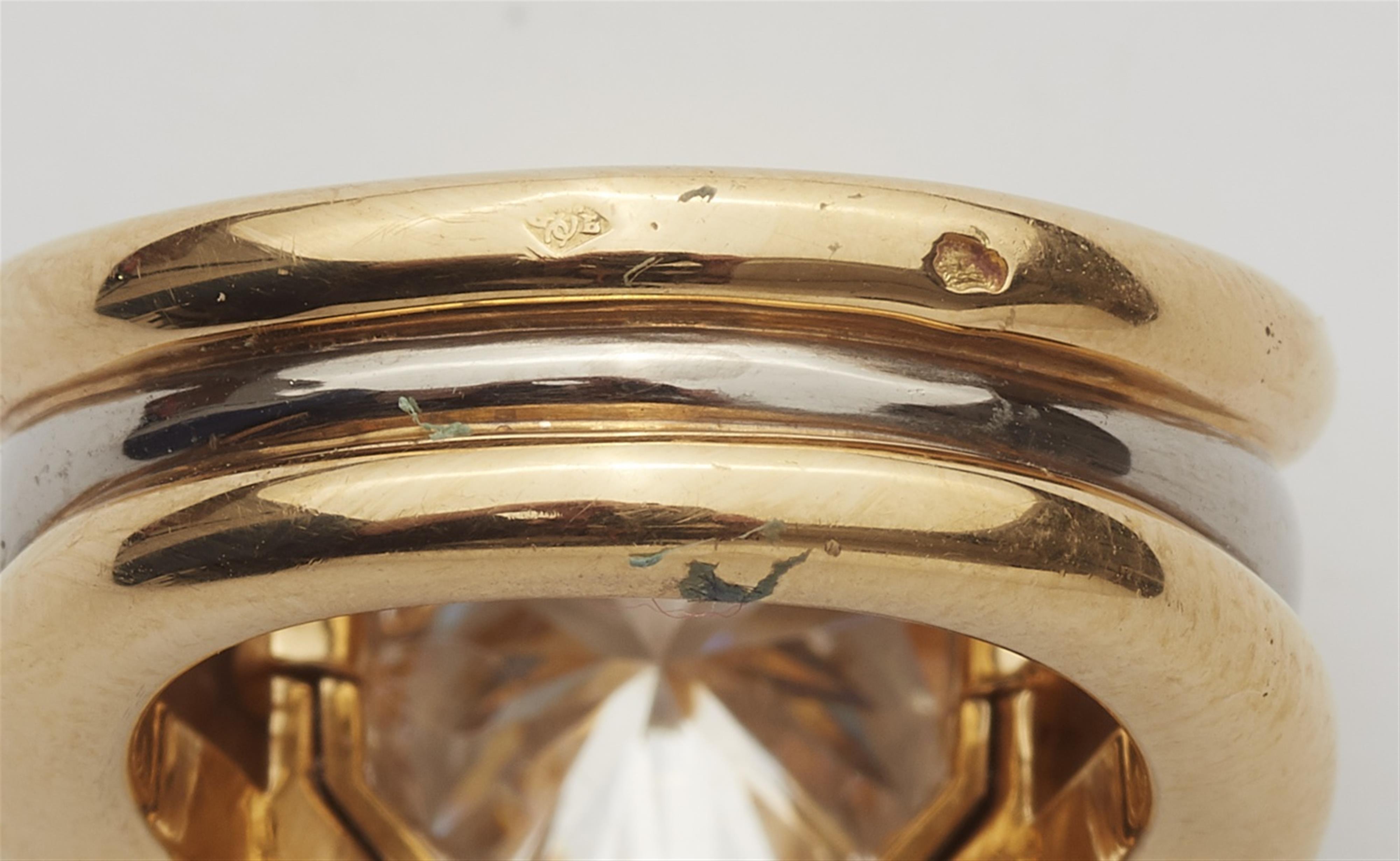 An 18k bi-colour gold ring with a diamond solitaire - image-4