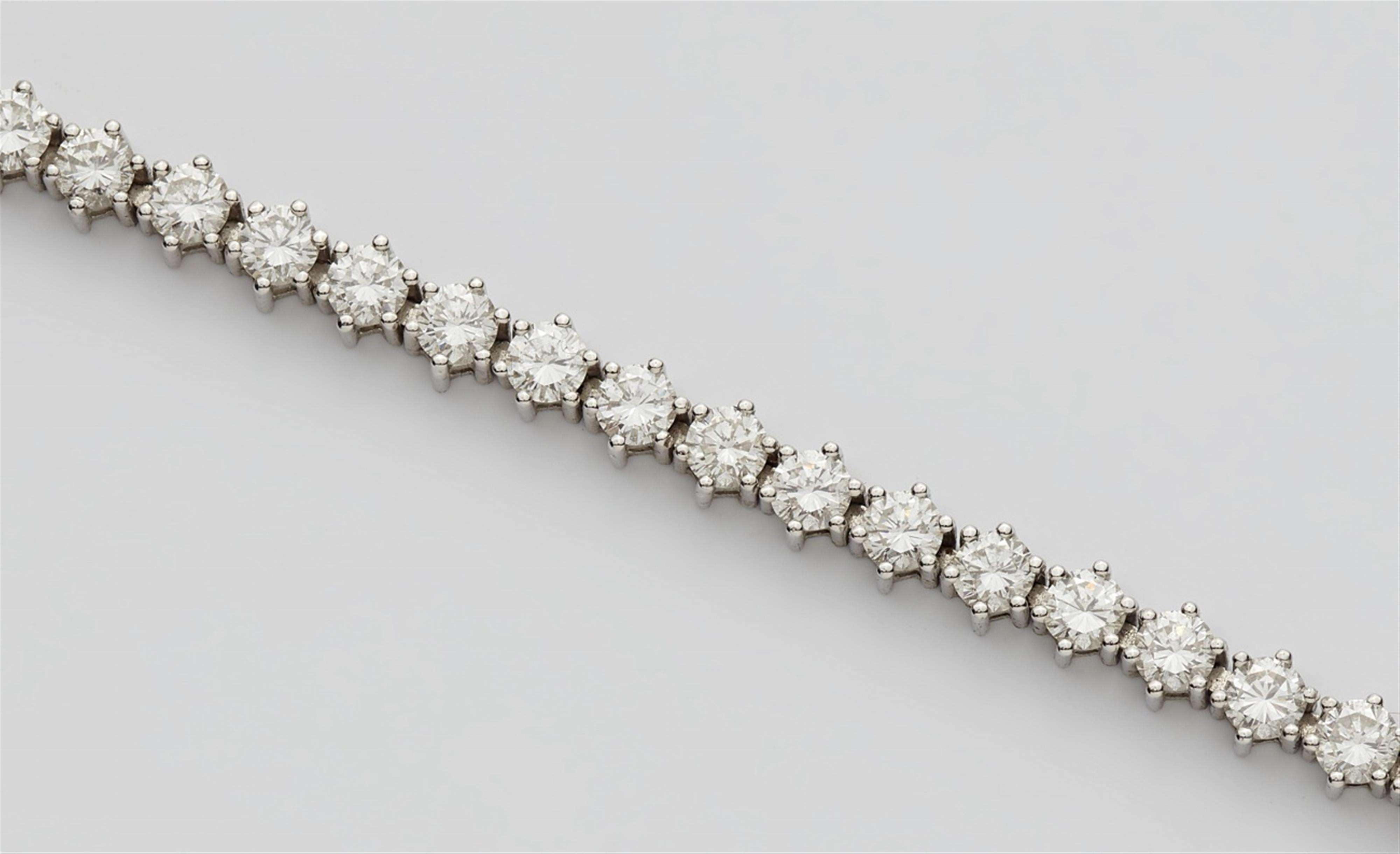 An 18k white gold and diamond rivière bracelet - image-3