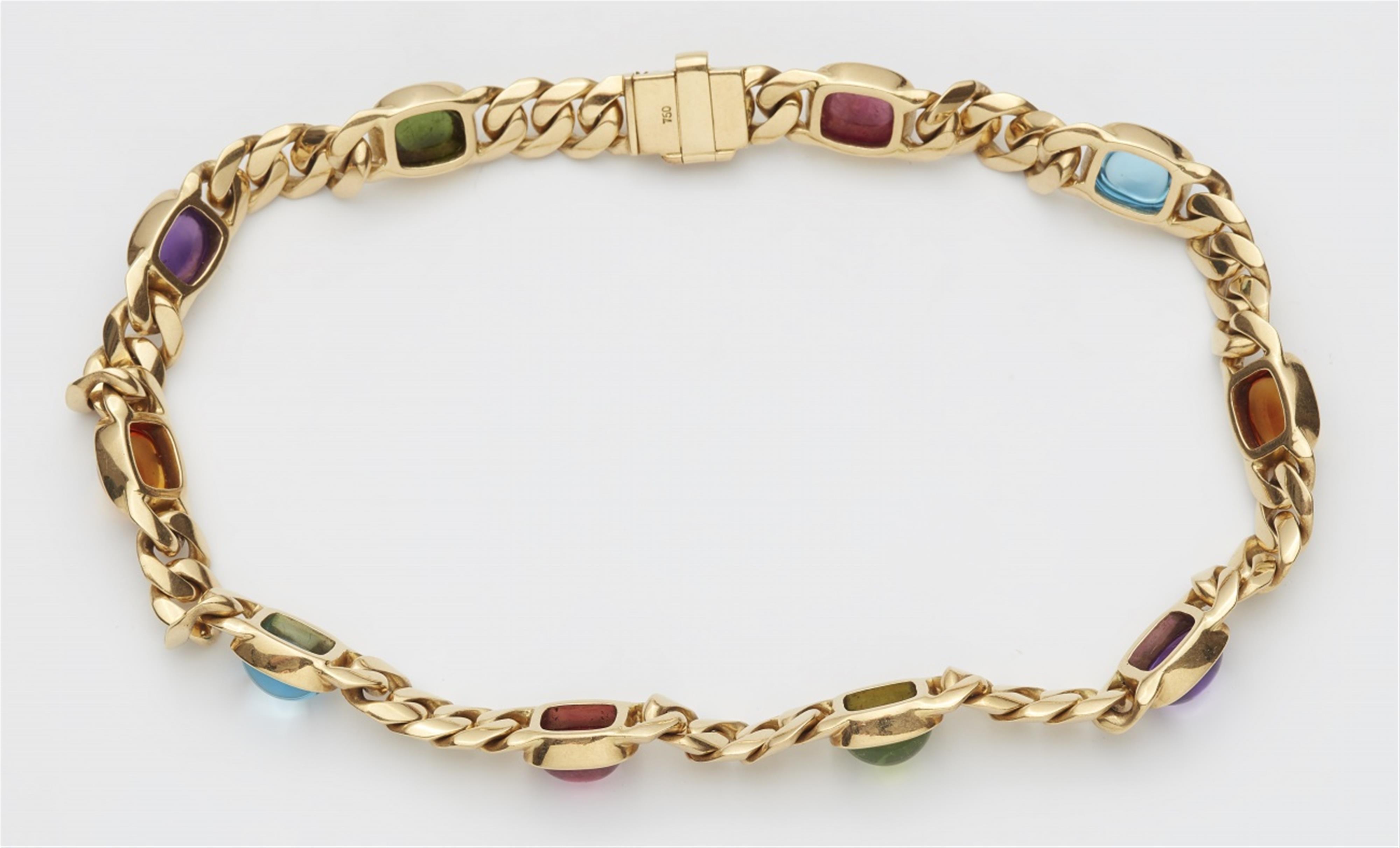 An 18k gold and coloured gemstone necklace - image-2
