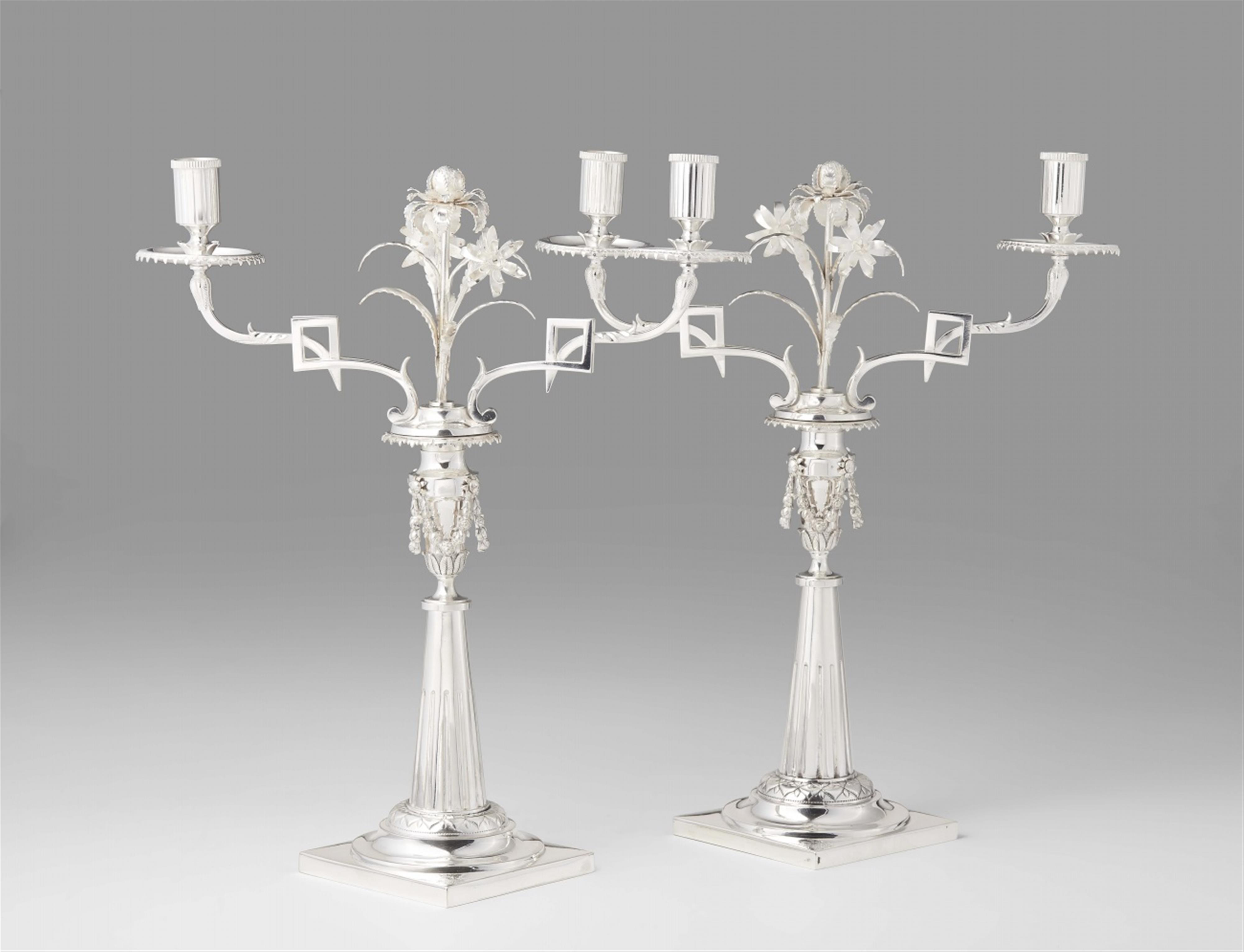 A pair of Augsburg silver candelabra - image-1