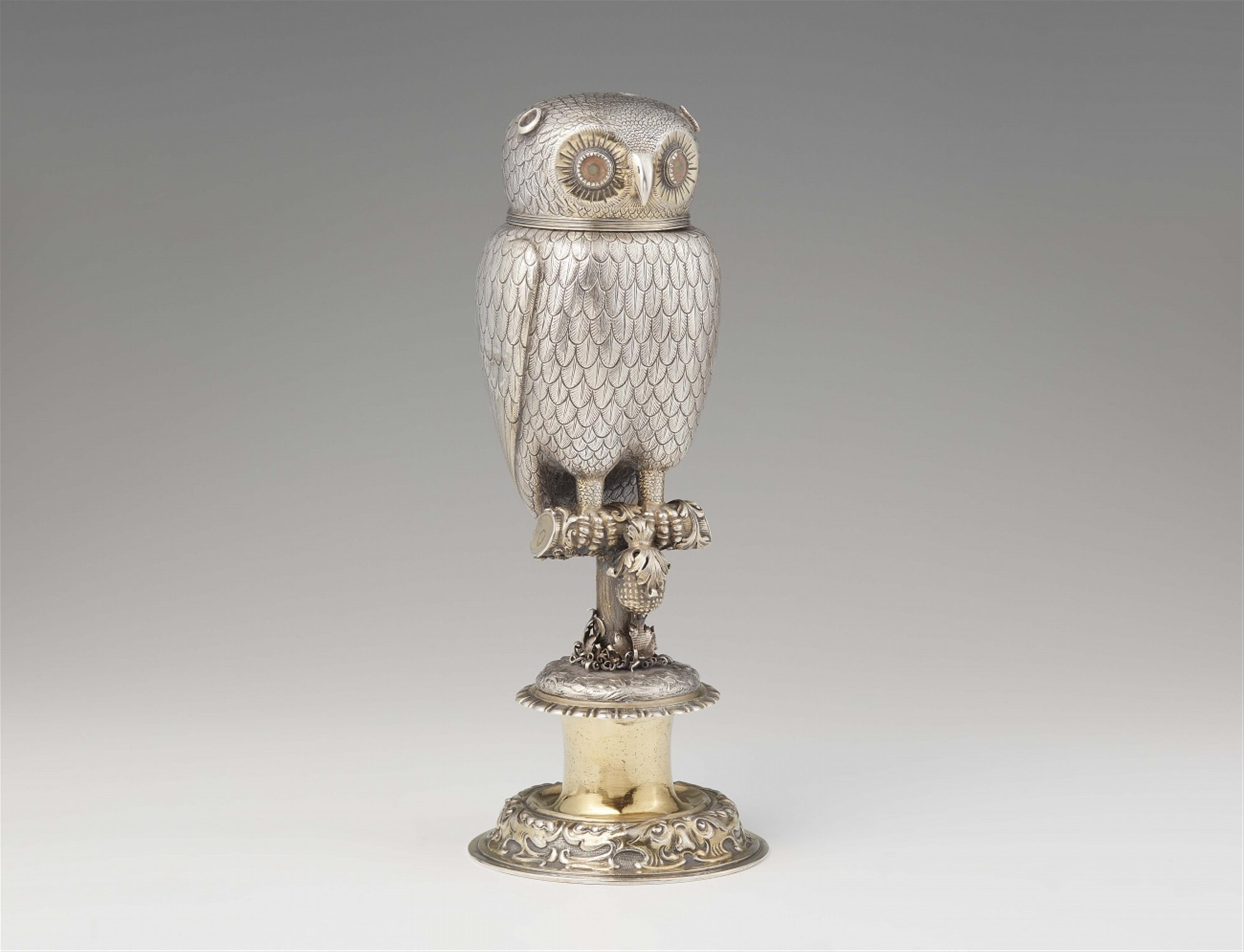 A parcel gilt silver drinking vessel formed as an owl - image-1