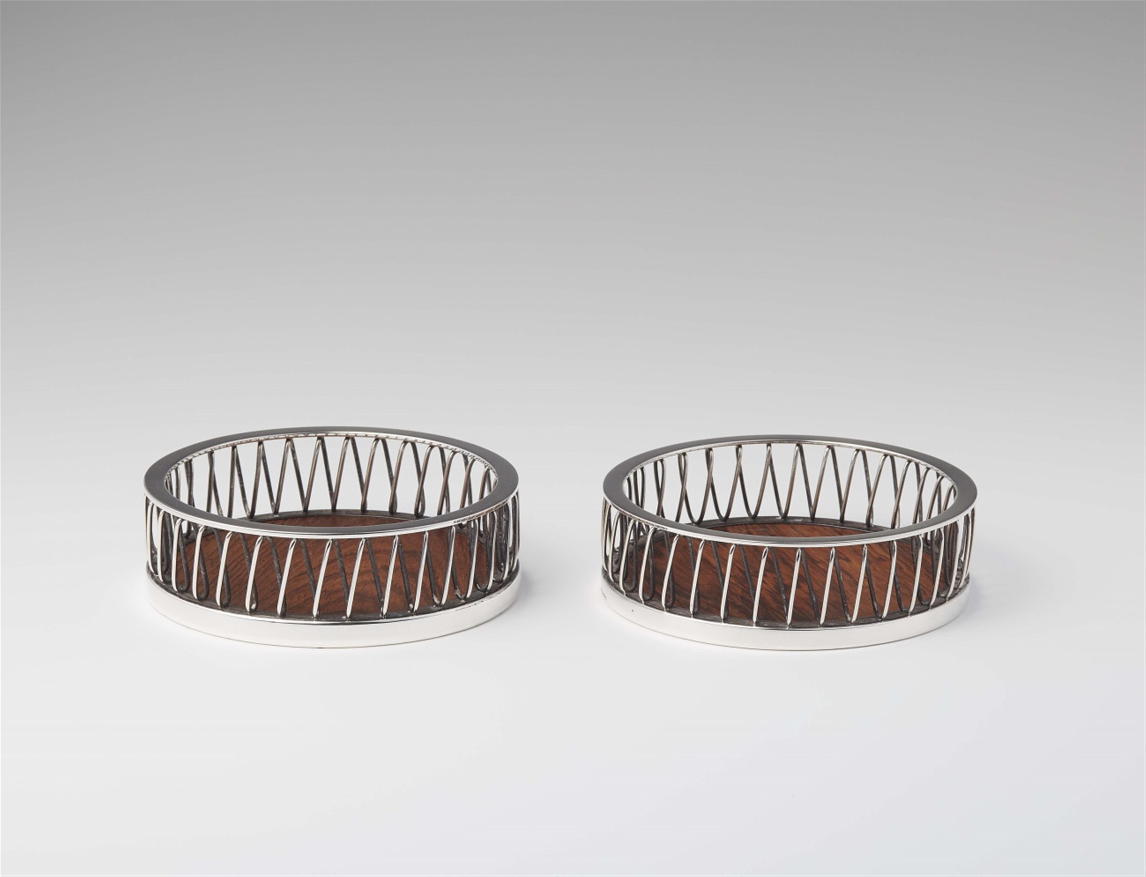 A pair of mid-century Aarhus silver bottle stands - image-1