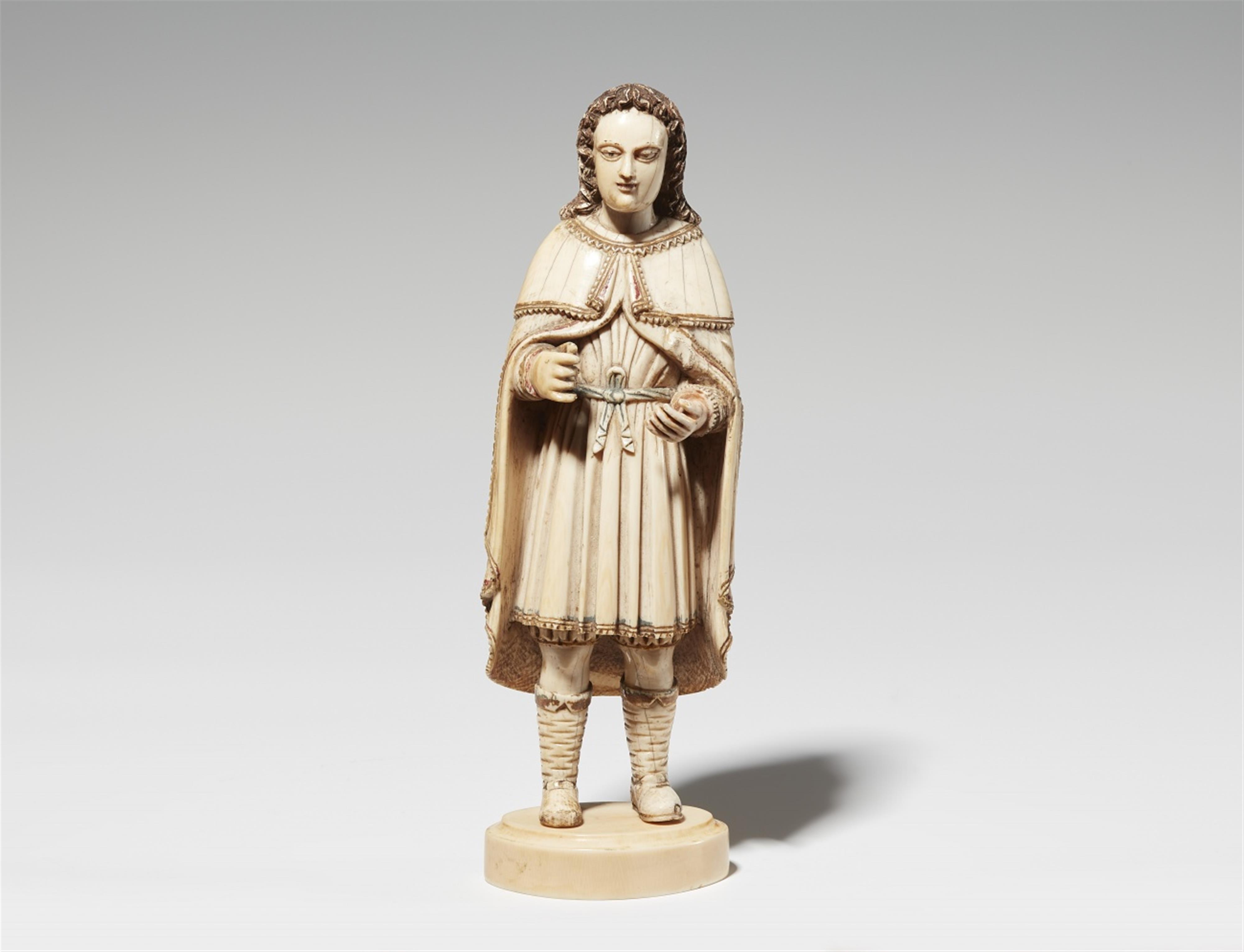 A carved ivory figure of a man - image-1