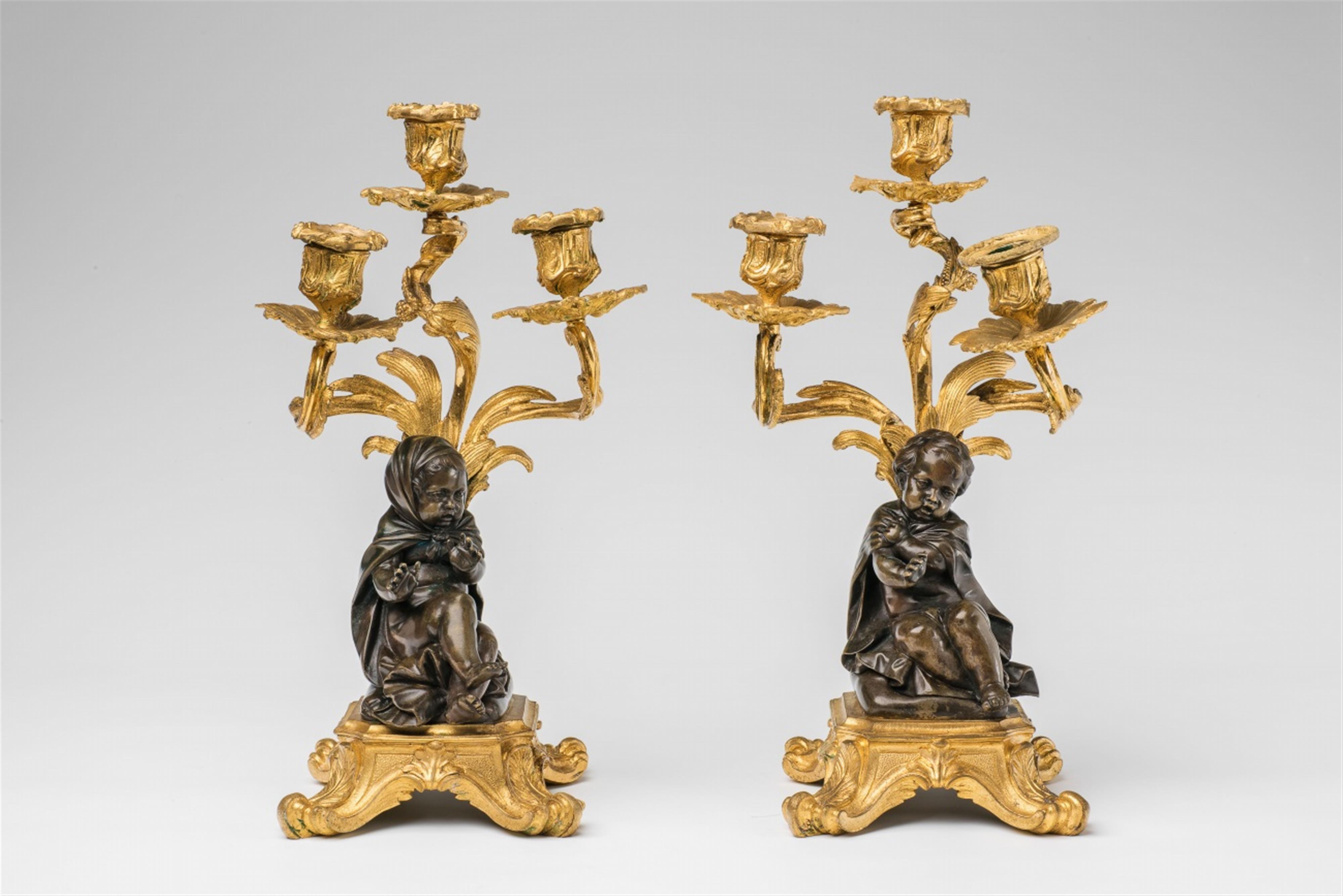 A pair of gilt bronze candelabra with children as an allegory of winter - image-1