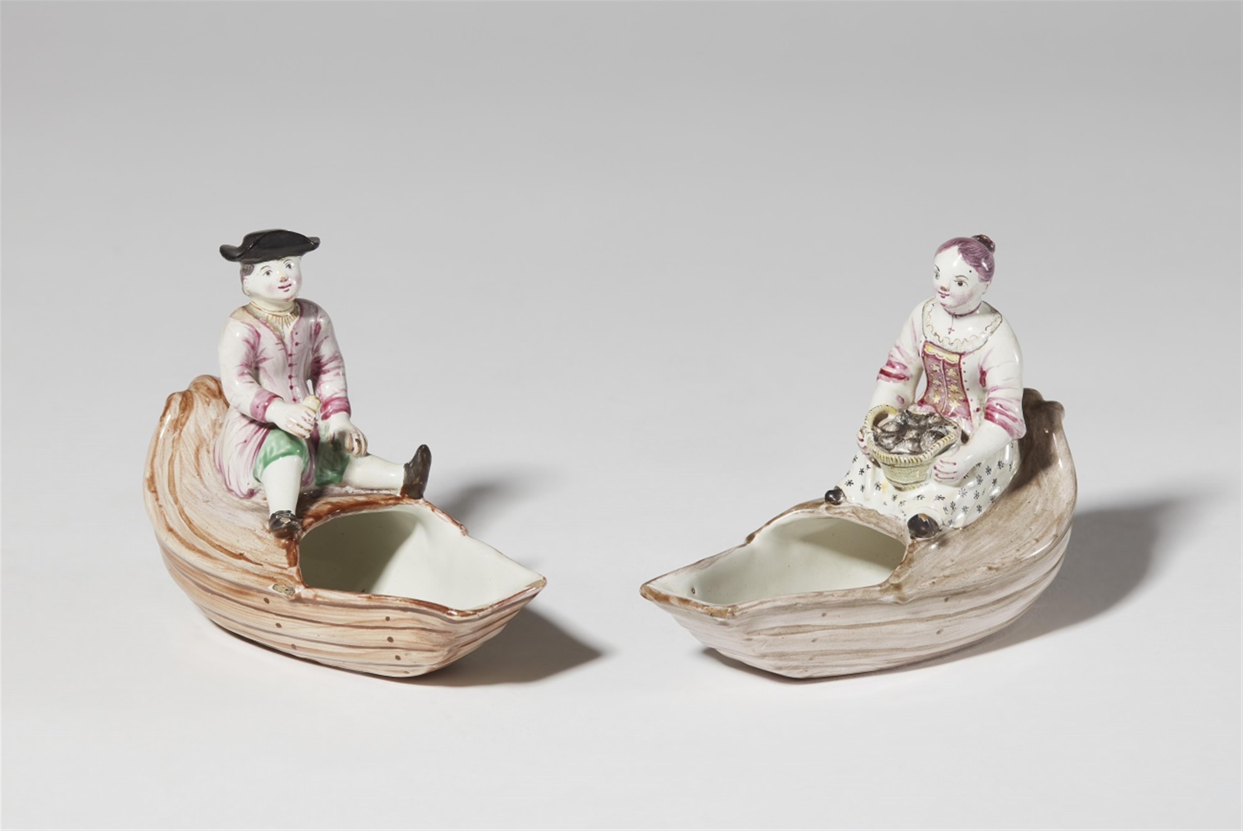 A pair of Strasbourg faience condiment dishes with figures - image-1