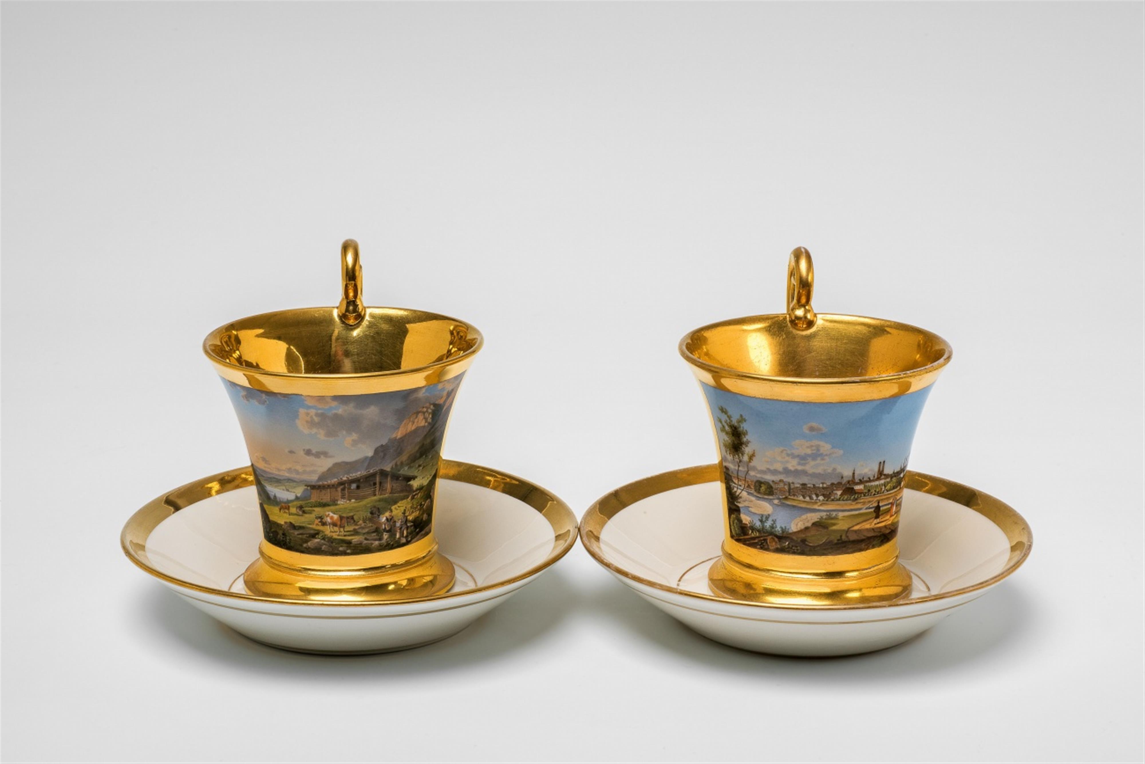 A pair of Nymphenburg porcelain cups with views of Bavaria - image-1