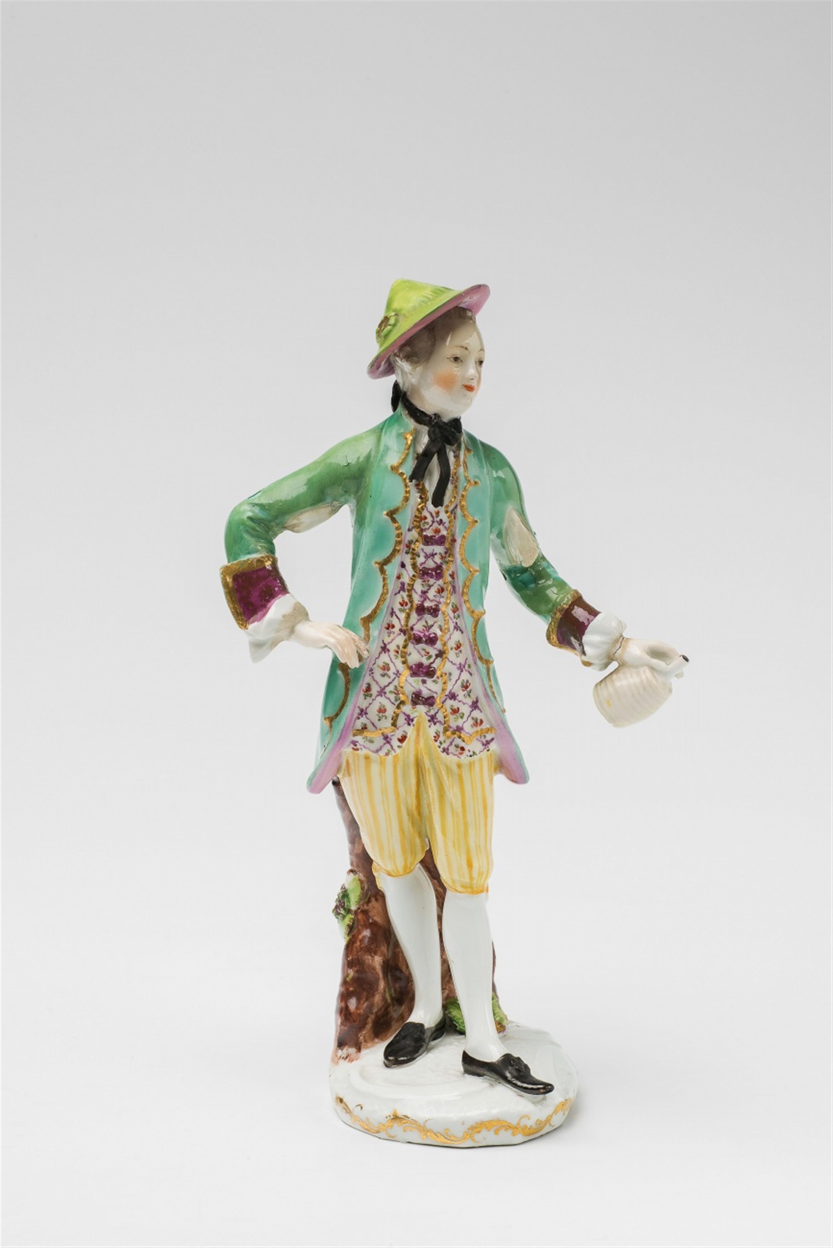 A Vienna porcelain figure of a gentleman as a butler with a wine bottle - image-3