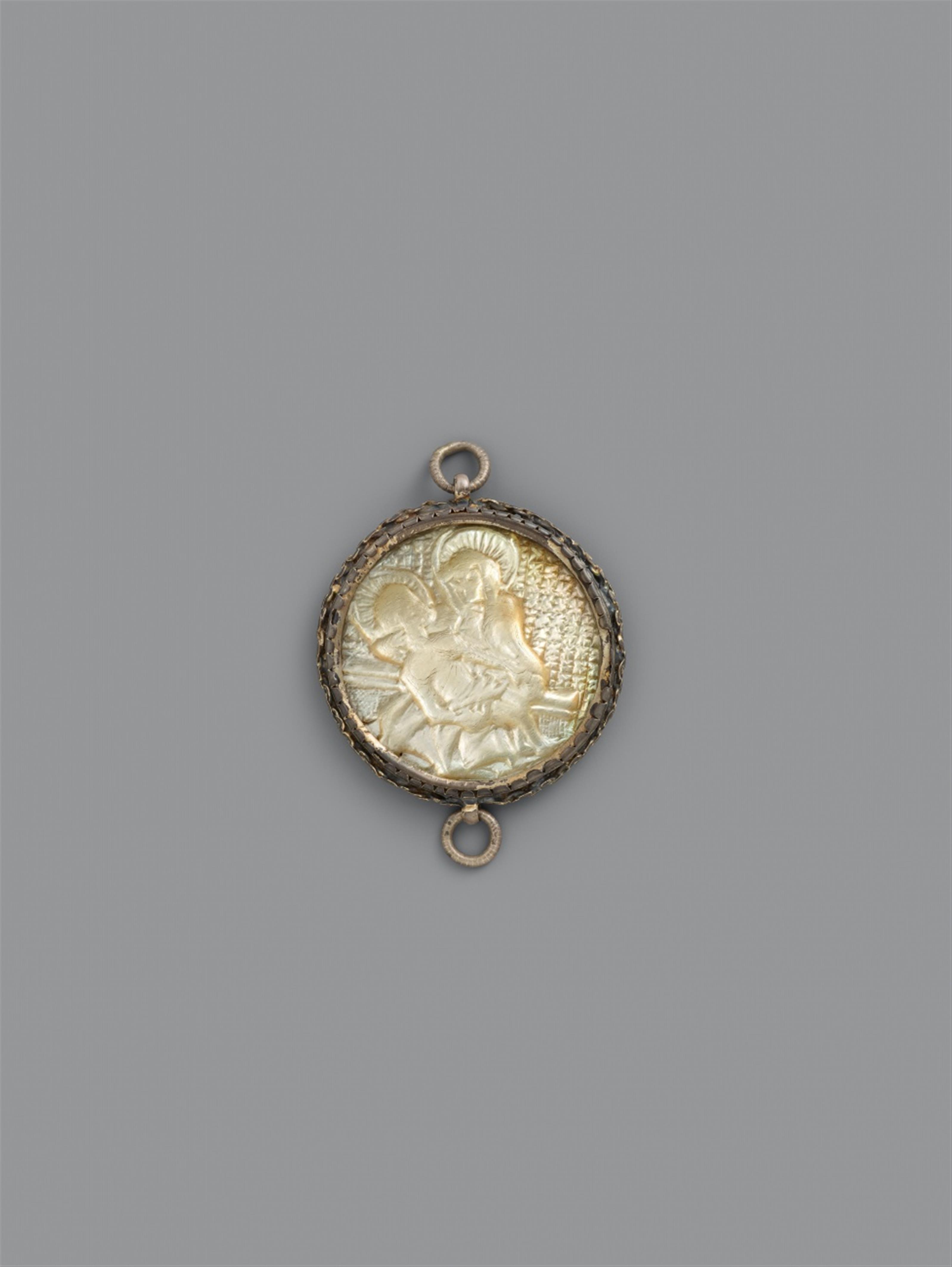 German late 15th century - A late 15th century German carved mother-of-pearl pendant with the pietà and Saint Margaret - image-1