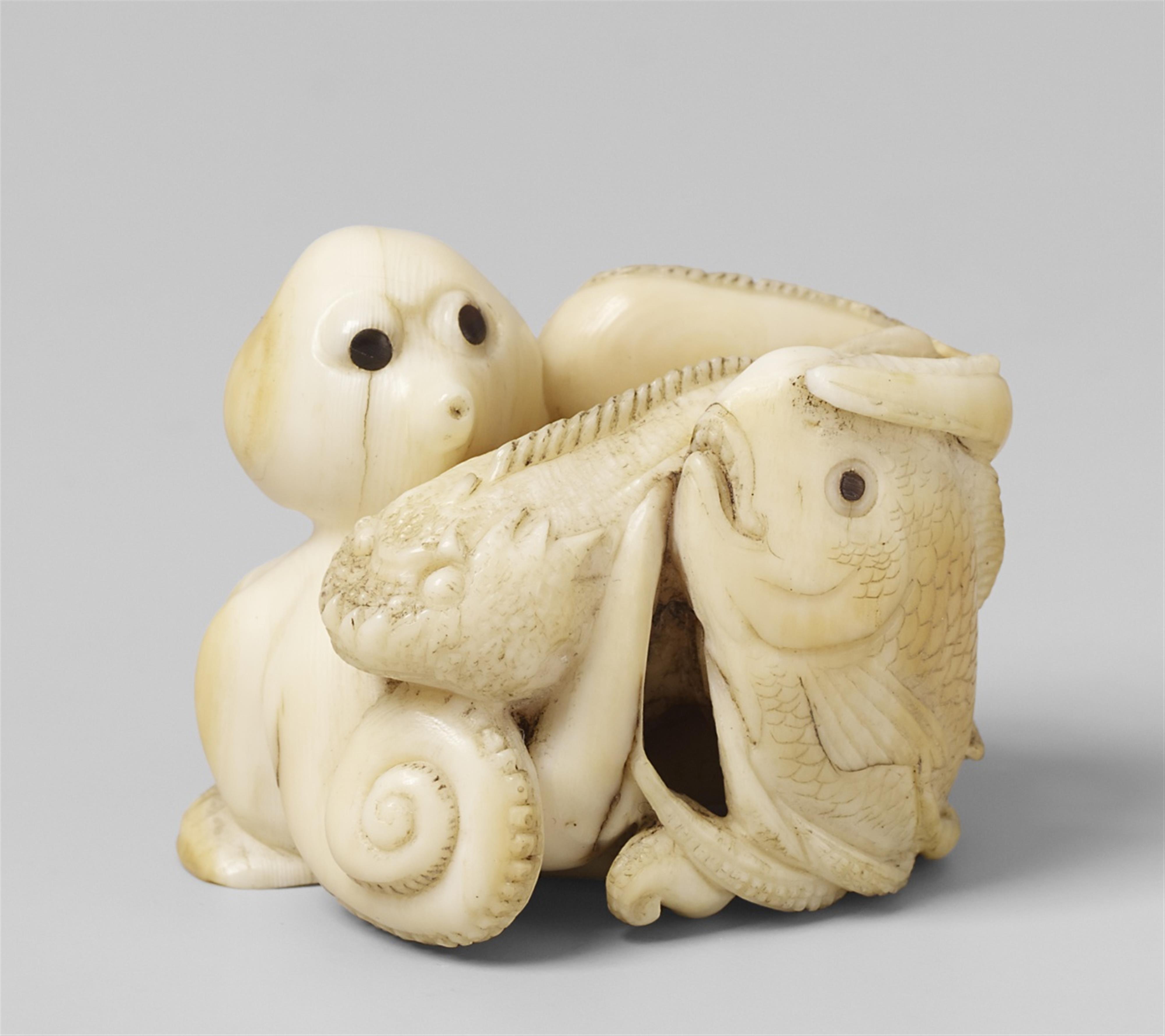 A walrus tusk netsuke of an octopus with fish. 19th century - image-1