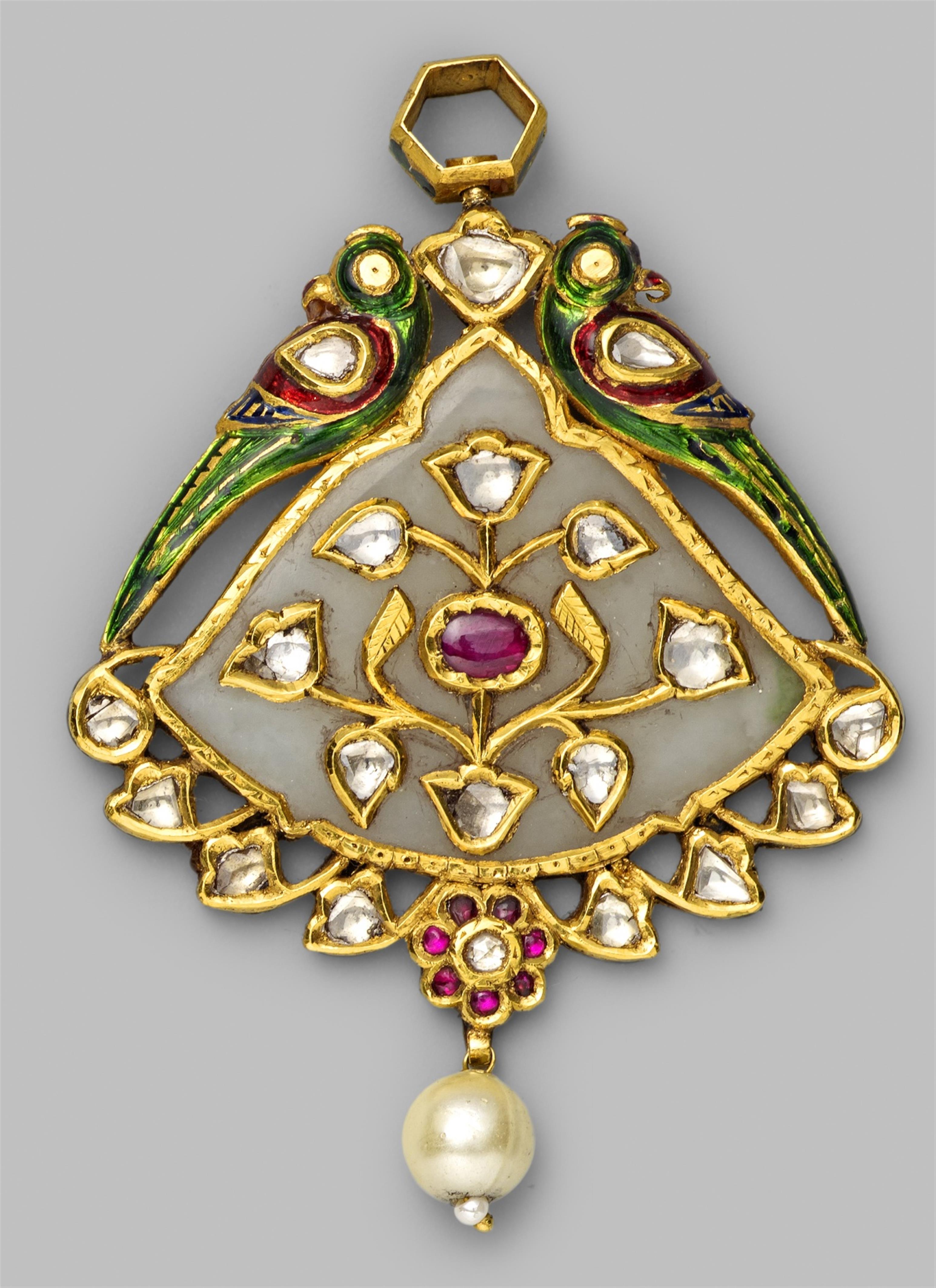 A North Indian white jade pendant set with foil-backed rubies and diamonds in gold and enamels. Possibly Jaipur - image-1