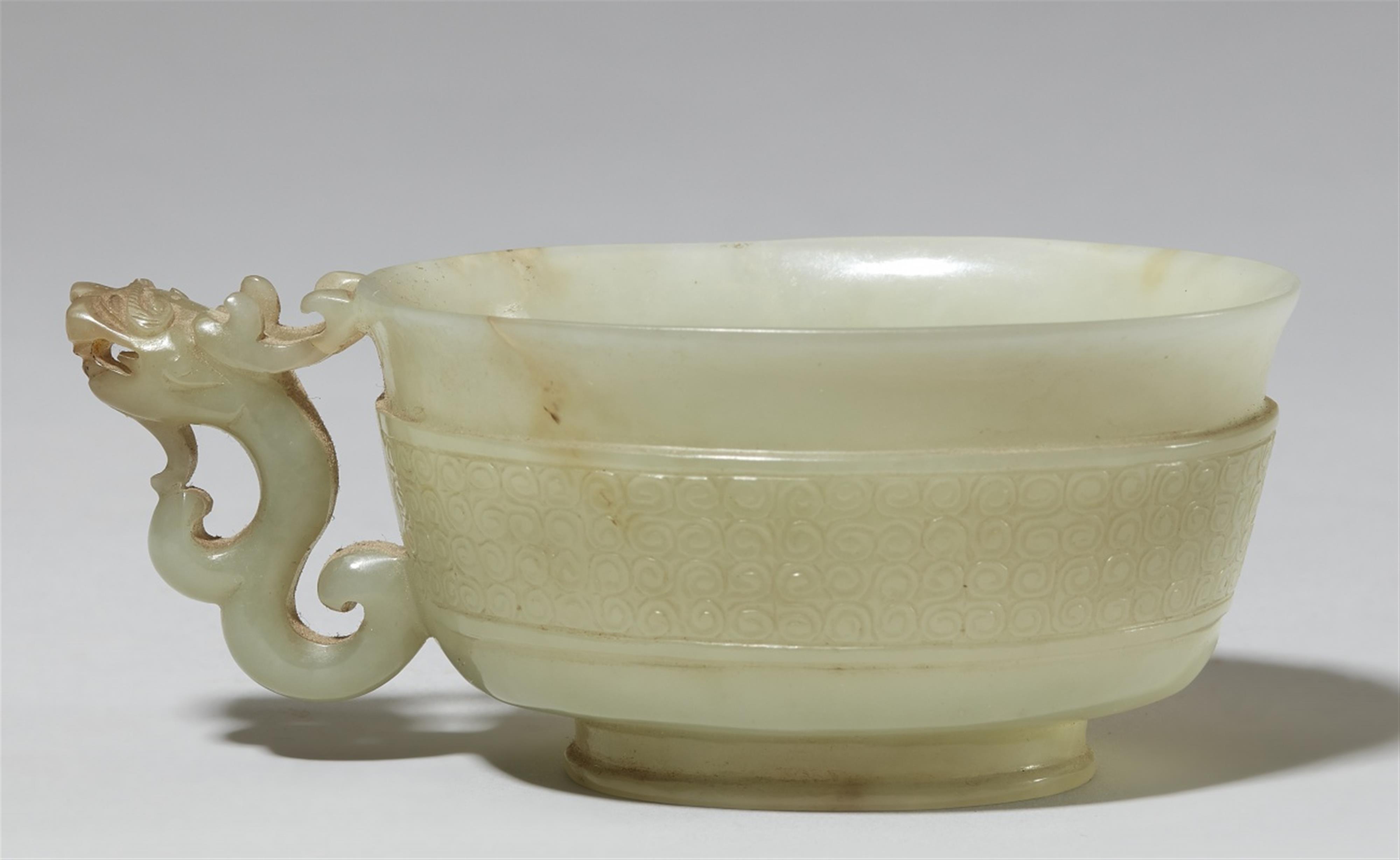 A finely carved celadon jade handle cup. 17th century - image-1