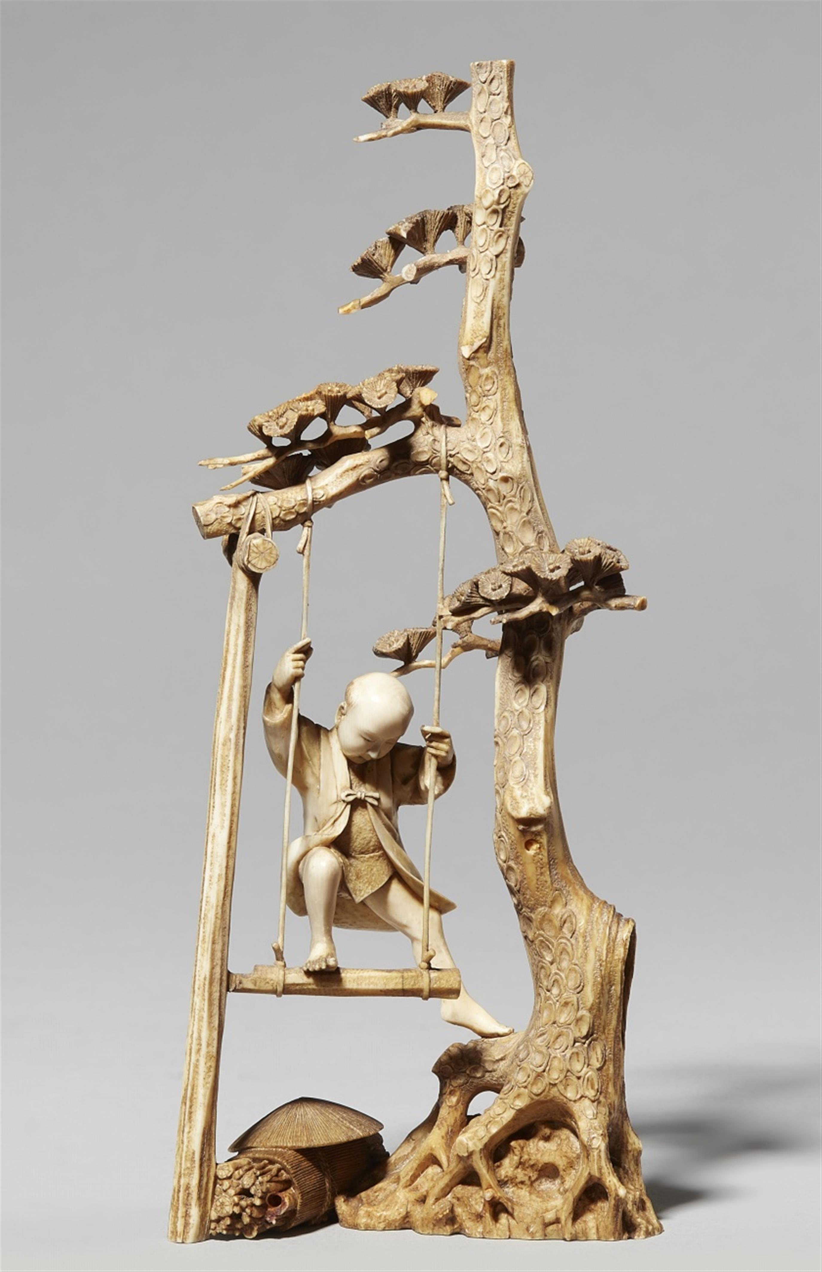 An ivory okimono of a boy on a swing. Late 19th century - image-1