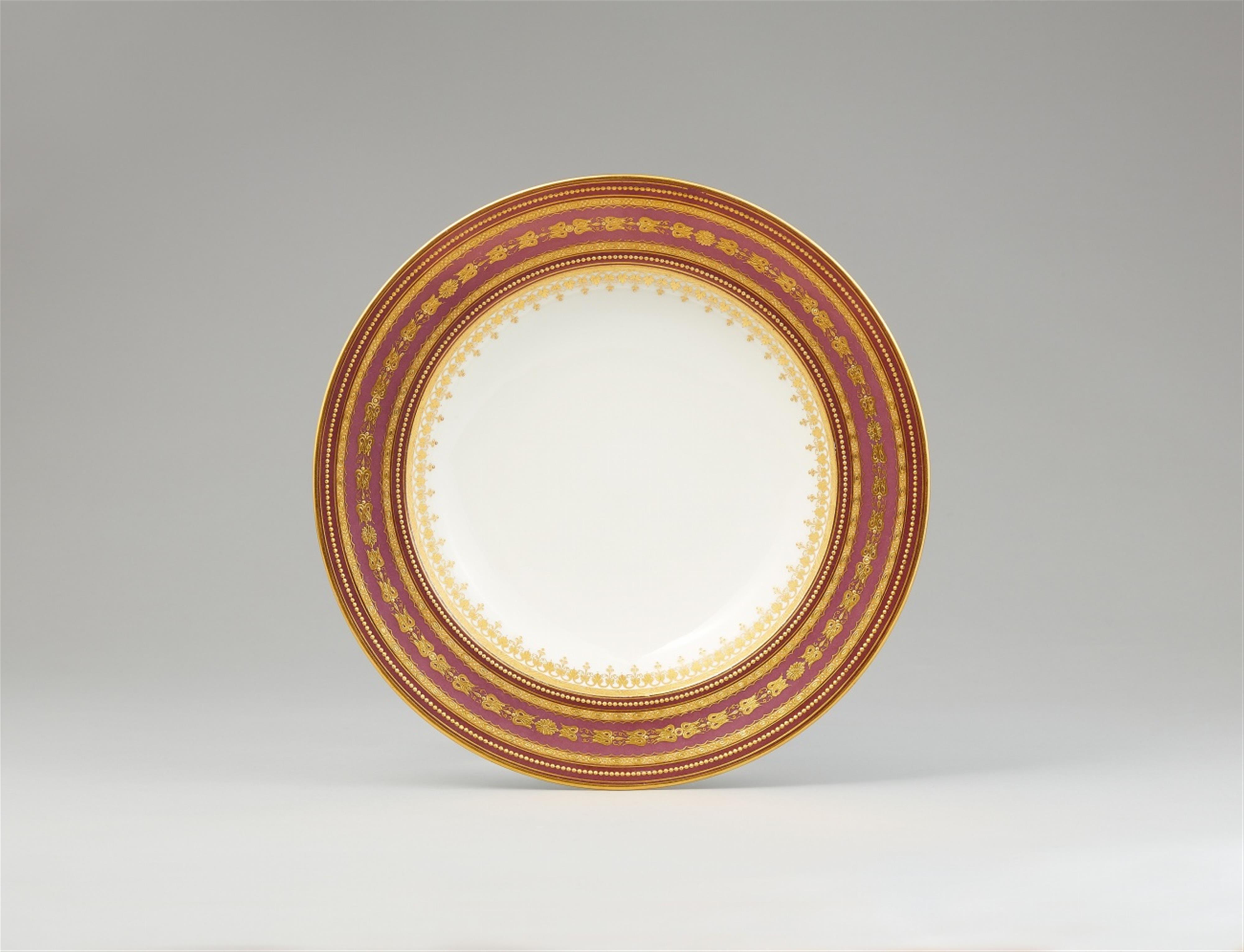 A Vienna porcelain dinner plate with bi-colour copper lustre ground - image-1
