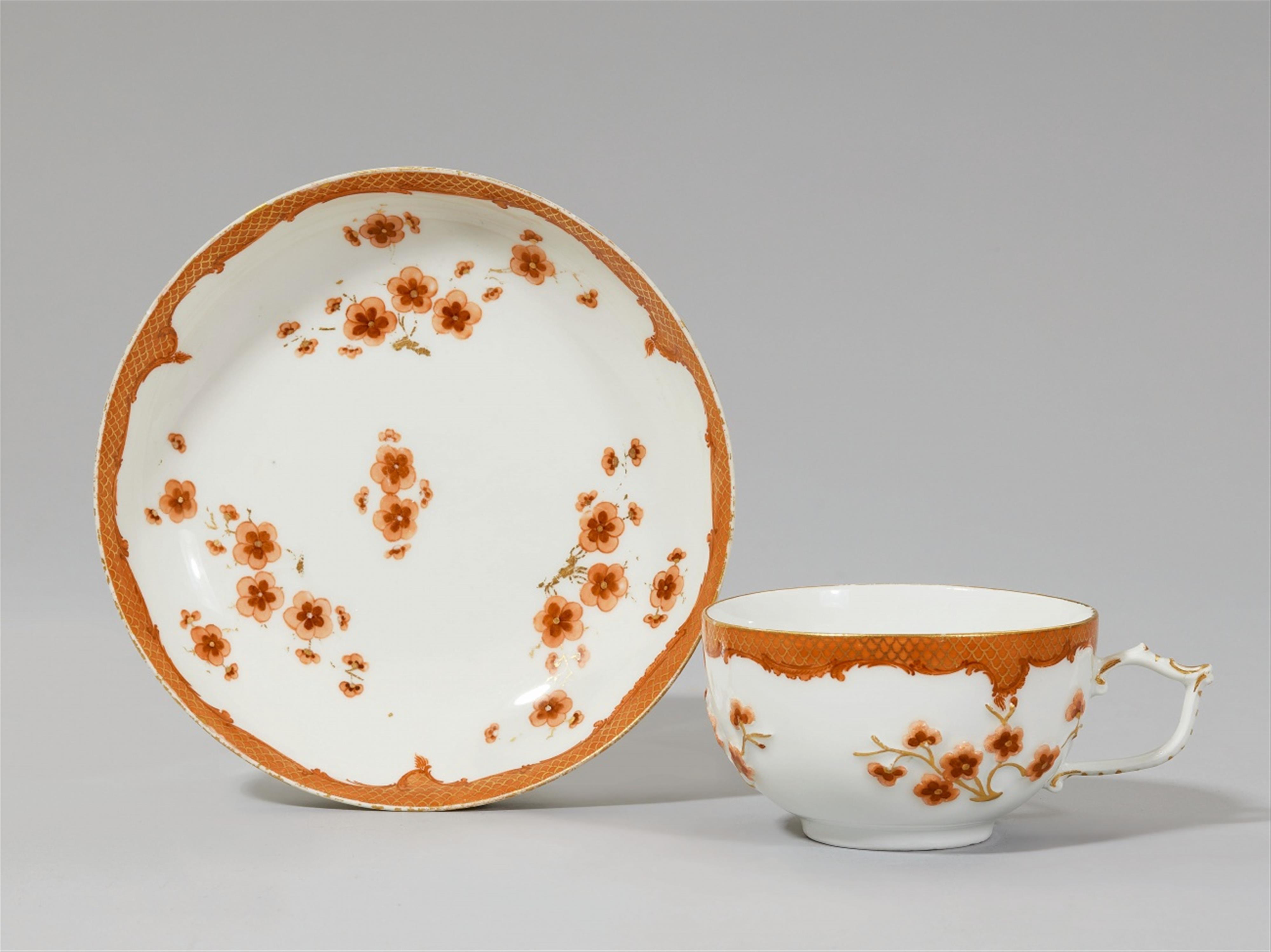 A Meissen porcelain cup and saucer from a coffee service with iron red mosaic pattern borders made for Frederick II - image-1