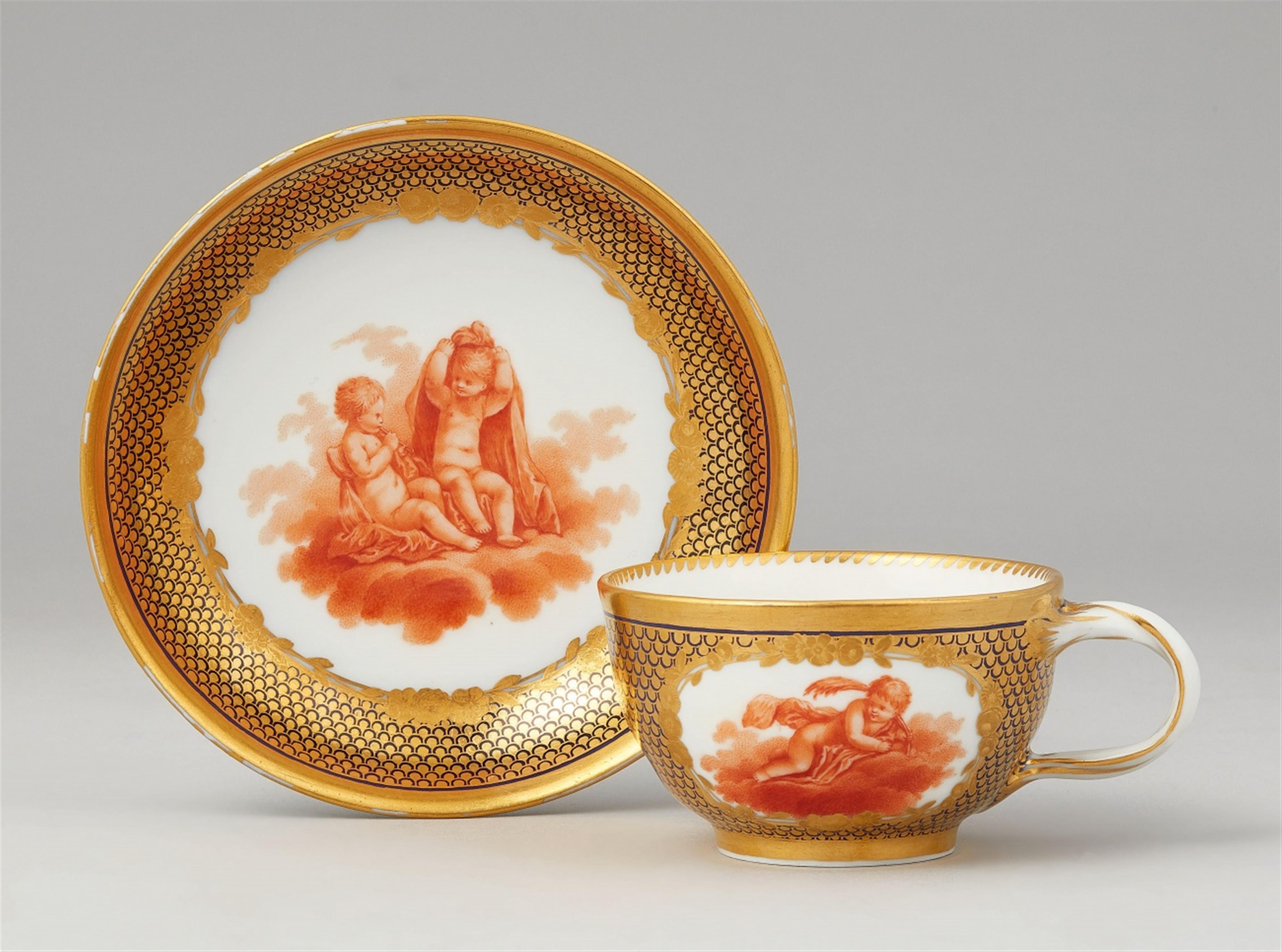 A Berlin KPM porcelain cup and saucer from a service with flying children - image-1