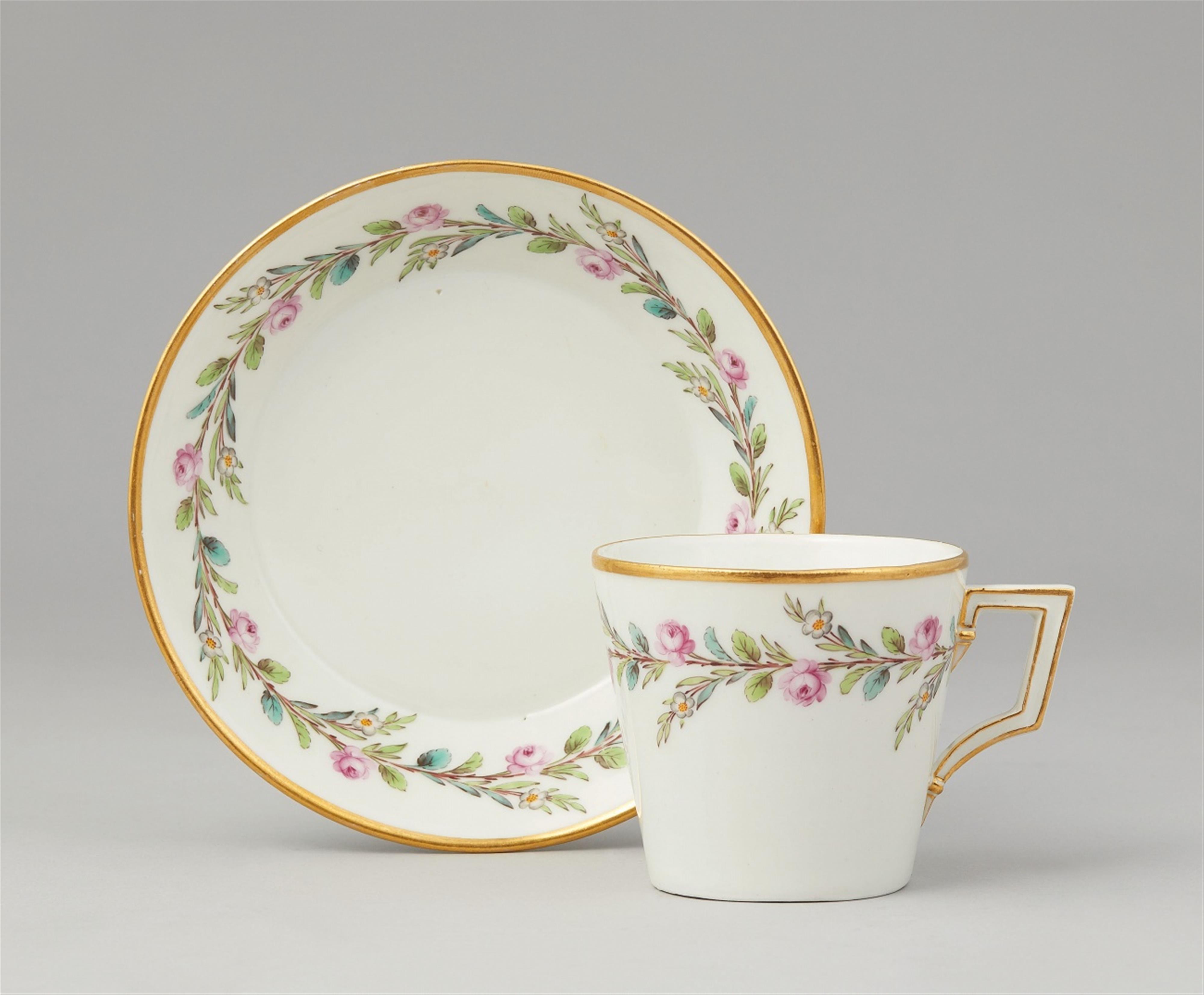 A Berlin KPM porcelain cup and saucer with rose tendrils - image-1