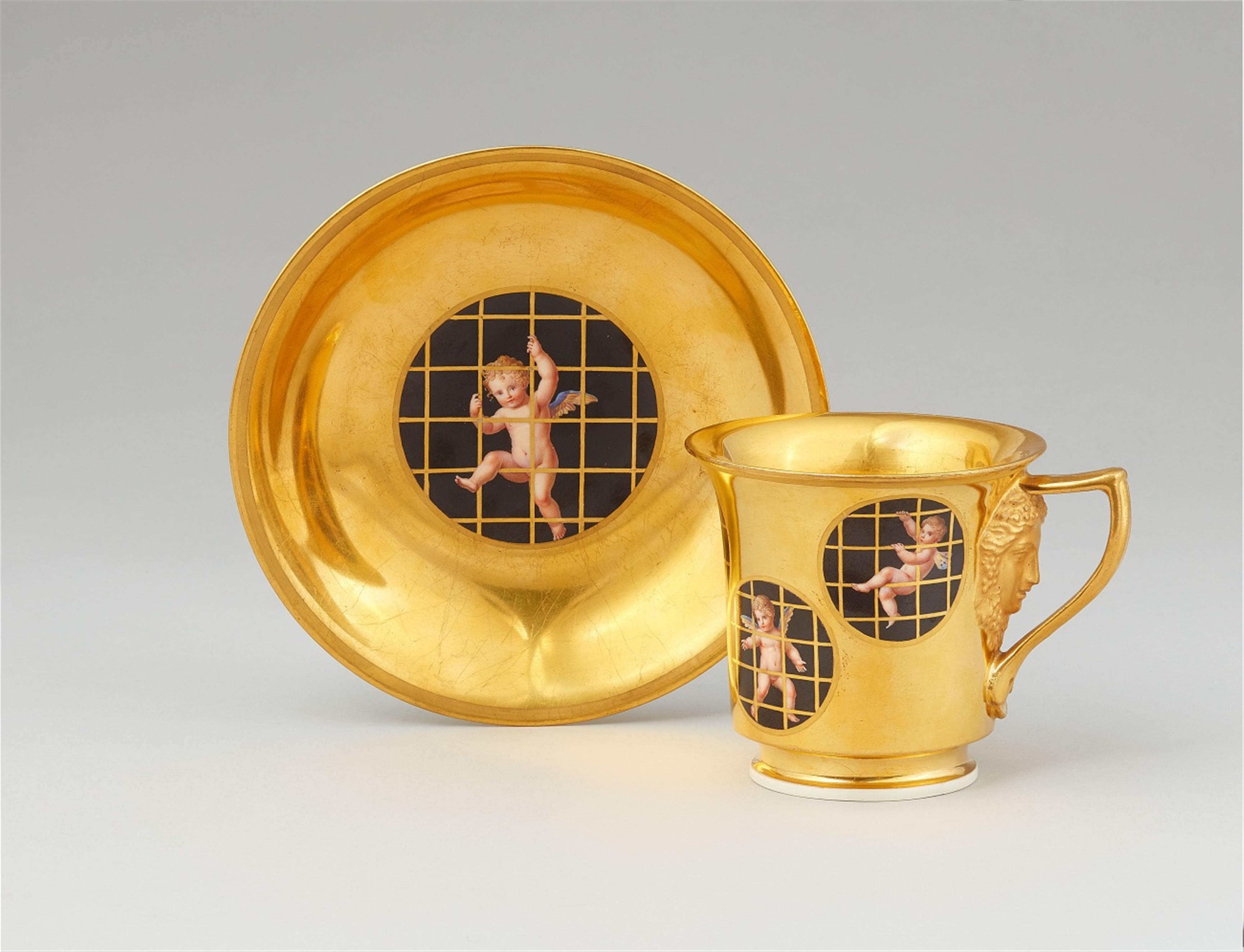 A Vienna porcelain cup and saucer with Cupid imprisoned - image-1