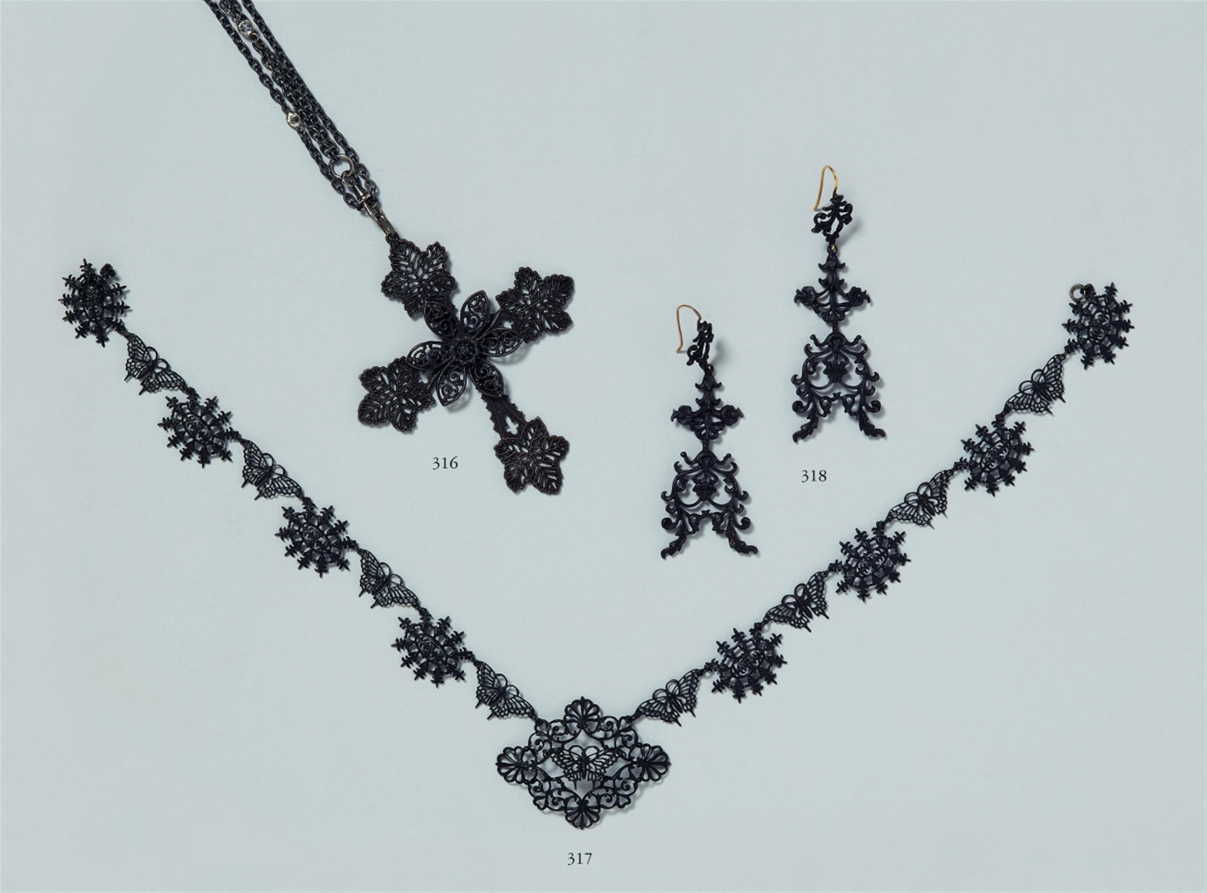 A cast iron necklace with butterfly motifs - image-1