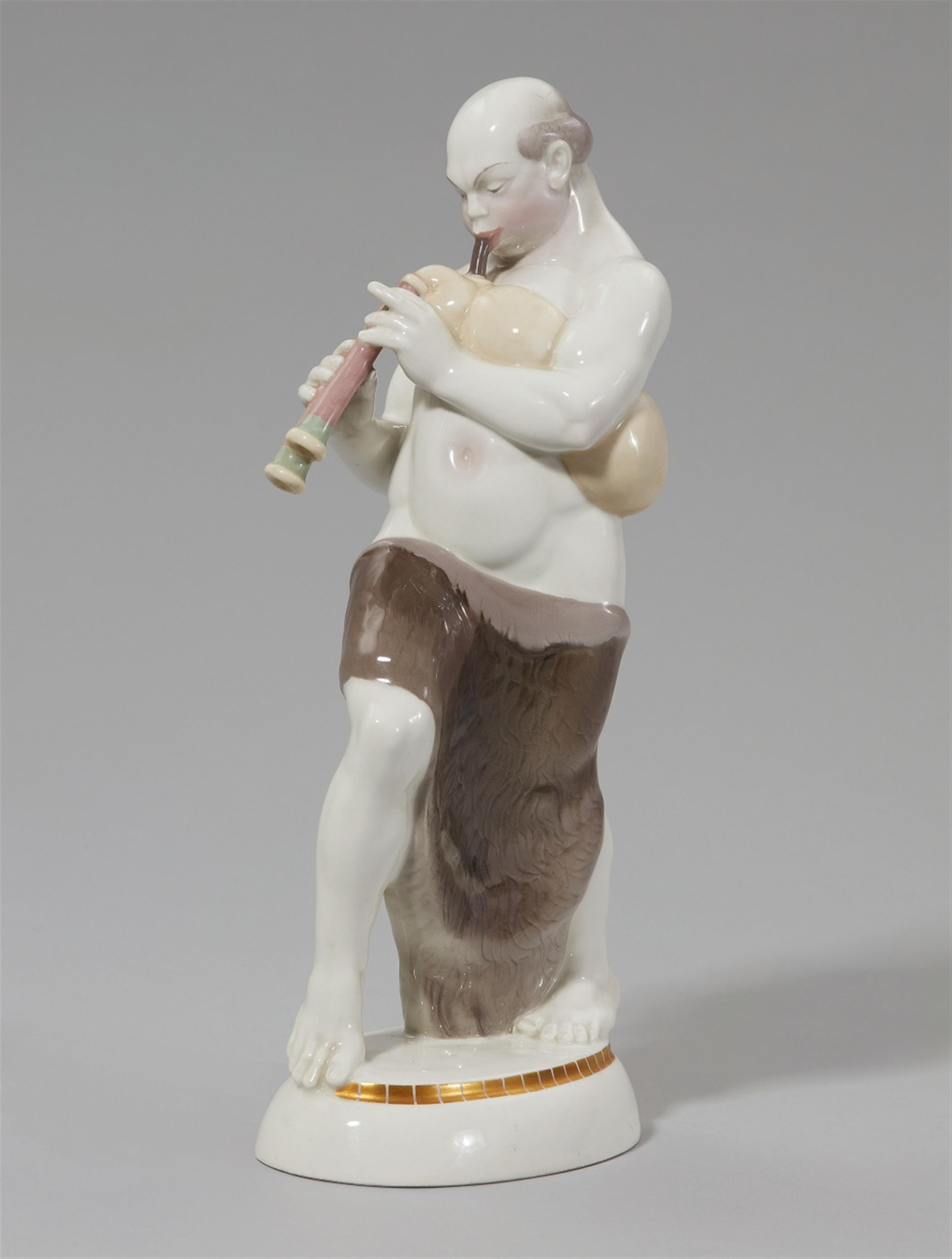 A Berlin KPM porcelain figure of an Arabian man playing bagpipes - image-1