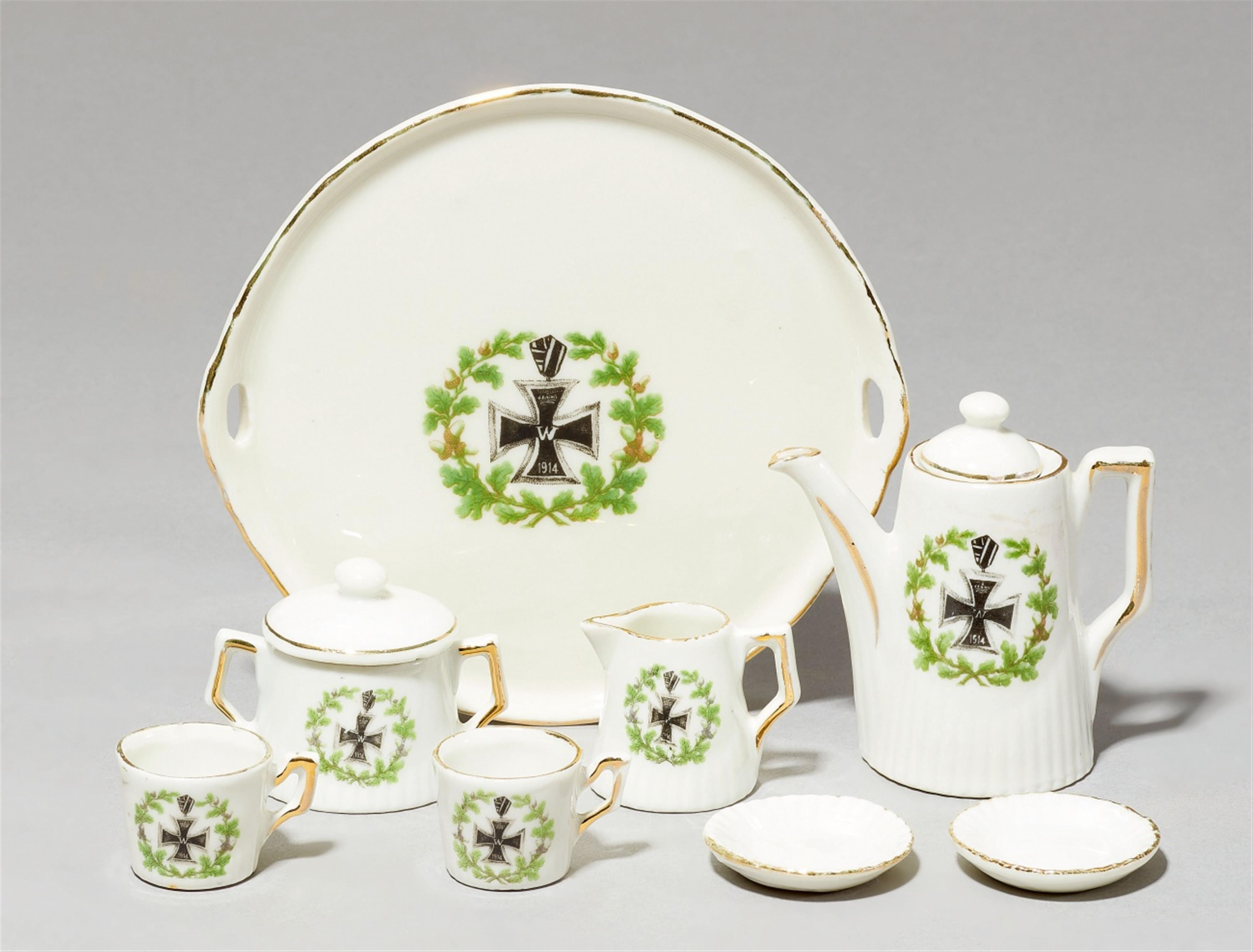 A porcelain dolls' house coffee set with the iron cross - image-1